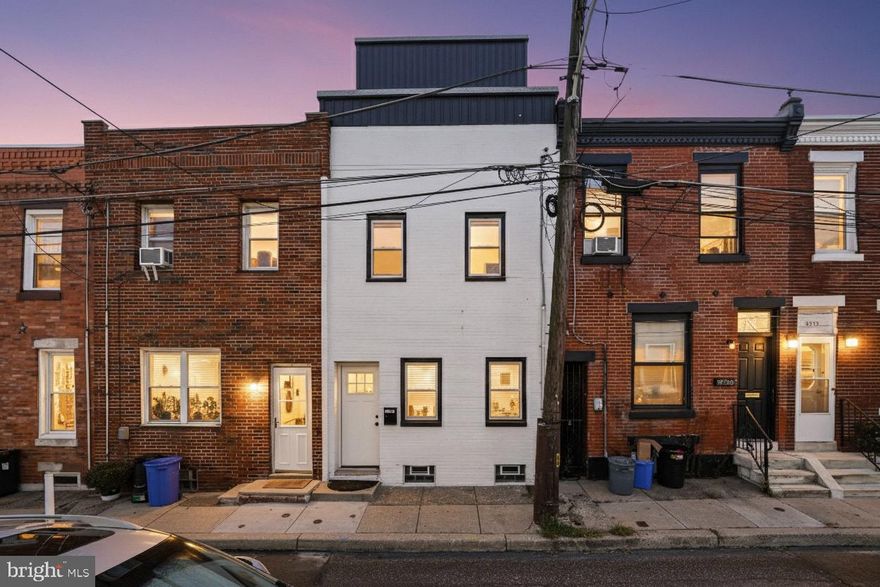 estled on a quiet, low traffic street in the heart of Philadelphias vibrant Port Richmond neighborhood, 3289 Tilton Street offers a beautifully renovated three story home that is perfect for modern living. This charming property features three bedrooms, two and a half bathrooms, a finished basement, and multiple outdoor spaces, including a stunning roof deck. The fresh white exterior with bold black accents creates an inviting first impression.
Step inside to find a bright and airy main level with high ceilings, recessed lighting, and sleek new flooring throughout. The living room is filled with natural light from two large windows, while the dining area provides plenty of room for hosting gatherings. Just beyond the powder room, the kitchen stands out with crisp white shaker cabinets, black countertops, stainless steel appliances, and a chic subway tile backsplash. Out back, the private patio offers an ideal space for summer barbecues or casual outdoor dining.
The finished basement provides flexible space that can serve as a media room, home gym, or extra storage area. On the second level, two spacious bedrooms are separated by a pristine bathroom, offering both privacy and comfort. The entire top floor is dedicated to the primary suite, which includes a generous bedroom, a potential walk in closet, a full bathroom, and access to a serene terrace.
The highlight of the home is the expansive roof deck, an entertainers dream that allows you to enjoy sunny days and warm evenings with family and friends. Additional features include central air conditioning, gas heating, and a gas water heater.
An added bonus is the remaining nine years on the property tax abatement, offering significant savings and making this home an excellent investment opportunity.
Located in a prime spot with a Walk Score of 92, 3289 Tilton Street is just a short stroll from popular restaurants, coffee shops, parks, and gyms. Shopping centers with stores such as Target and Home Depot are only ten minutes away, and there is convenient access to I95 and South Jersey. Do not miss the chance to see this stunning home. Schedule your tour today.