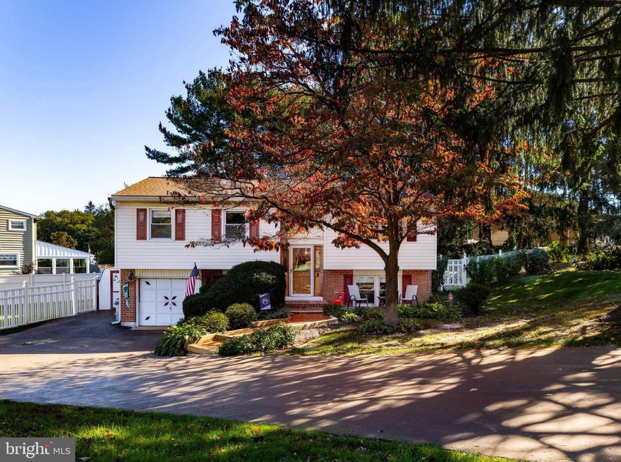 Welcome to this beautifully maintained split-level home on a spacious corner lot in the desirable Hidden Valley neighborhood of Aston, Pennsylvania. From the moment you step inside, you’ll appreciate the attention to detail and modern updates throughout.
The ceramic tile entry opens to a bright and inviting living room featuring hardwood floors that flow through to the bedrooms. The heart of the home is the fully updated kitchen, boasting luxury vinyl plank flooring, white cabinetry, quartz countertops, a large island with seating, undermount sink,  subway tile backsplash, stainless steel appliances, gas cooking, and recessed lighting—perfect for everyday living or entertaining.  A charming bow window floods the space with natural light. Down the freshly painted hallway, you’ll find three comfortable bedrooms and full bath complete with a shower/tub combo and spacious vanity.
The lower level offers exceptional versatility with a large open family room, gas fireplace, half bath, and an additional room ideal for a home office, gym, or guest space. A three-season room extends your living area and opens to the backyard oasis—featuring a large concrete pool, fenced yard, deck, koi pond, and storage shed. Additionally the home features a a newer roof,  drain system, one car garage with new garage door opener, as well as a large semi-circle driveway. Ample parking for multiple vehicles.  Located close to restaurants, shopping, airport, and a short drive to Philadelphia!
This home combines modern updates, flexible living space, and a fantastic outdoor setting—all in a sought-after neighborhood.  For added peace of mind, the seller is including a 2-10 Home Warranty with the sale. Don’t miss your chance to make this Hidden Valley gem your next home!