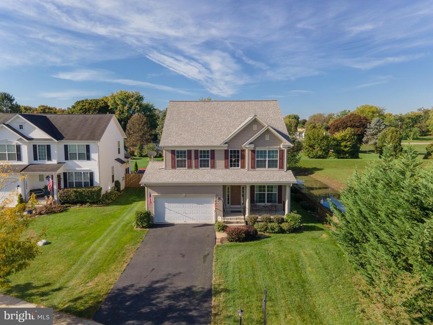 Welcome to the envy of the neighborhood!  This property is an entertainer's dream that greets you  with a relaxing front porch, open floor plan, large rear covered deck with 750 sq ft of additional space, a custom paver patio with built-in fire pit, fenced yard, and the finished lower level with walk out provides additional entertaining space with kitchenette.  Main level features traditional floorplan with formal living and dining rooms with hardwood flooring, a large kitchen featuring an island, pantry, and table space.  The adjacent family room features a gas fireplace, a main floor office/den,  half bath, and slider to rear covered maintenance free deck.   The upper level consists of 4 BR's featuring the primary bedroom that is indeed a suite with large sitting area, tray ceiling, spacious walk in closet and primary bath with 2 vanities, walk in shower, and garden tub.  Large laundry, full hall bath with tub shower combo and 3 additional bedrooms.  The lower level has a game/rec room, a 5th bedroom/exercise room, a full bath, and separate kitchenette great for in law suite or entertaining with walk out.    Economical natural gas heat,  new roof in 2020, and new hot water heater 2021, new carpet in family room & stairs and upper hallway.  Situated on private .36 acre fenced large corner lot .  The community features the Terrapin Park with tot lot, picnic space, basketball court, and walking trails.   Easy access to shopping, restaurants, and interstates.