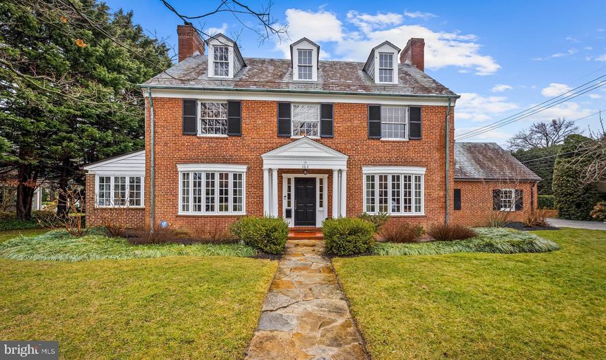 Located on one of Homeland’s most picturesque blocks, 103 St. Dunstan’s Road is a classic, well-maintained brick colonial offering timeless architecture and generous proportions throughout.  A gracious living room has a wood-burning fireplace, and both the formal living and dining rooms feature new large bay windows that bathe the home in natural light. Just off the living room, a bright sunroom provides an ideal, flexible space for a home office or playroom. Gleaming hardwood floors extend throughout the home, and a cozy main-level den with an adjacent full bath offers the option for a fifth bedroom or guest suite.
The pristine updated kitchen has stainless steel appliances and quartz countertops, and opens to a comfortable breakfast room for more casual dining. Just off the breakfast room is a breezeway which connects to the attached garage and leads to the flat rear yard, complete with a brick patio ideal for entertaining, playing, or gardening. 

Upstairs, the spacious primary bedroom features an ensuite bath and ample closet space. Three additional bedrooms, a full bath, and a generous hall closet complete the second level.  The large walk-up floored attic, accessible from the second-level hallway, has a bath rough-in and presents outstanding potential for future finished living space.

Last but not least, the beautifully renovated and waterproofed lower level adds exceptional versatility, offering a recreation room with a gas fireplace, a half bath, a laundry center, additional finished flex space, and abundant storage.

This prime Homeland location is convenient to schools, shops, downtown, and commuter routes both north and south. Don’t miss this wonderful opportunity to make this home your own!  First showings begin on March 3rd.