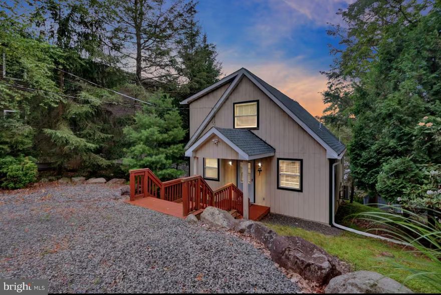 Welcome to 114 South Lake Drive—an exceptional lakefront property located in the highly desirable Lake Harmony community. This 3-bedroom, 2-bathroom home offers private lake frontage and a thoughtfully updated interior and exterior, making it perfect as a year-round residence, vacation getaway, or income-producing short-term rental. With an established rental history and being sold fully furnished, it's a turnkey opportunity for investors and lifestyle buyers alike.

Inside, the home features vaulted ceilings, an open-concept living and dining area, and a gas fireplace that adds warmth and character. Recent upgrades include a tankless hot water system (2025) and a three-stage water treatment system with UV filtration. A garbage disposal and keyless entry add everyday convenience.

The outdoor space is designed for enjoying all that lake life has to offer. A new lower deck and dock provide the perfect setting for entertaining or simply relaxing by the water. Additional features include electric power run to the shed, motion-activated lighting, new heated gutters with gutter guards, and an EV charging station. A powerboat is also included in the sale, offering immediate access to fun on the lake.

Whether you're looking for a peaceful lakeside retreat or a proven short-term rental property, 114 South Lake Drivedelivers unmatched value, location, and lifestyle.