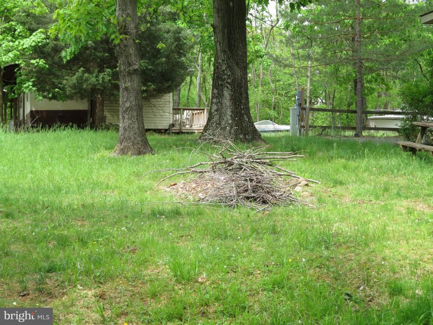 This lot is ready for YOU and your RV!!!
Nice level vacant lot tucked away in the back of Riverbend RV Park with a GREAT WATER VIEW!  Lot features water and electric hookups, shed, paved driveway, fire pit and Potomac River access for boating, fishing & swimming.  **LOT BACKS TO TREES FOR ADDED PRIVACY**  Yearly membership to Riverbend Park includes water, sewer/pump out services, electric, trash and access to the park amenities and activities such as pools, putt putt, basketball court, tennis court, holiday fireworks for July 4th, car show, carnival, restaurant, playground, ball field and much more. Riverbend RV Park is located close to shopping, I-81 & The C&O Canal for hiking & biking. Own this getaway in as little as 3 weeks!  Call today before it's gone.  **Gated community-pass required for entry. **Riverbend sales are SOLD "AS IS", CASH only and seasonal.** (Direct TV and Frontier Internet available with service install/hookup).