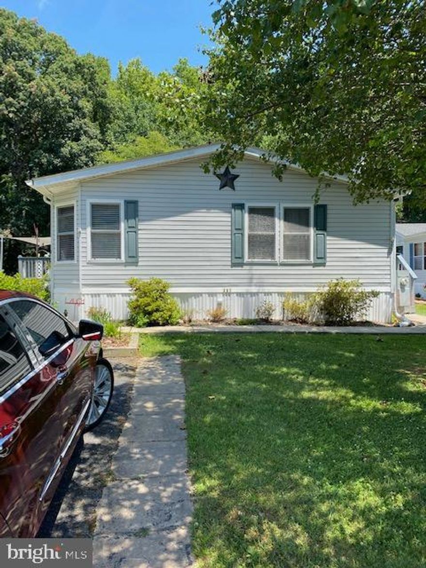 CUSTOM RENOVATED HUGE DOUBLEWIDE THAT BACKS TO WOODS ON PRIVATE STREET!!    UPDATES ARE AS FOLLOWS.   ENTIRE HOME HAS BEEN PAINTED.  NEW CEILING RECESSED LCD LIGHTS.   ALL NEW CEILING FANS.  NEW LAMINATE FLOORING THROUGH THE ENTIRE HOME.  ALL NEW BATHROOM VANITIES AND TOILETS.  ENTIRE MASTER BATH HAS BEEN REDONE WITH TILE SHOWER WITH RECESS AND BARN DOOR SHOWER SLIDER.   ALL NEW BLINDS.     ALL DECKS HAVE BEEN PAINTED.  NEW HOT WATER HEATER WITH NEW PIPES.   NEW ROOF FOR THE SHED.   THIS IS JUST THE BEGINNING AND SO MUCH MORE.   HOME SITS ON A GREAT LOT AND BACKS TO WOODS.   HOME HAS A LIVING ROOM, DINING ROOM, EAT-IN KITCHEN WITH ISLAND AND FAMILY ROOM WITH FIREPLACE.   THIS HOME IS A MUST SEE YOU WON'T BE DISAPPOINTED!!!