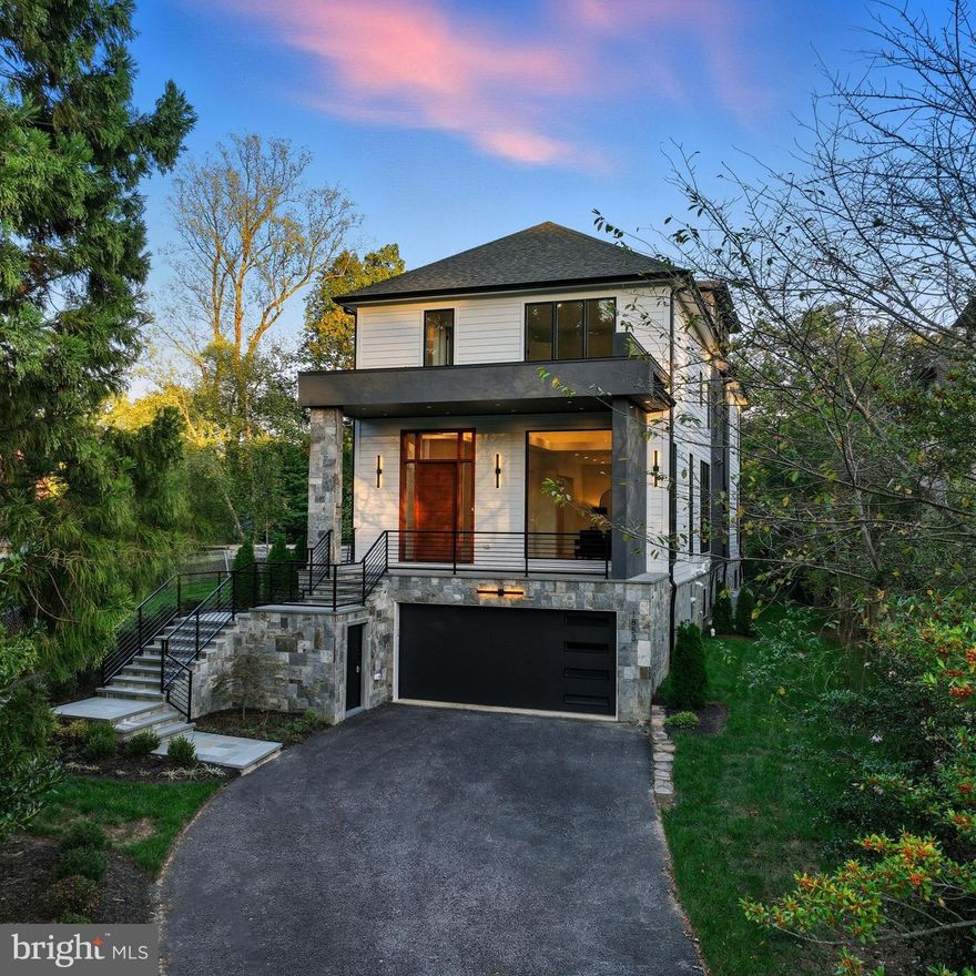 An exceptional new construction opportunity in Franklin Park, offering elevator access, move-in-ready luxury, and unmatched value in the heart of McLean. The lowest price for a new construction home in one of McLean’s most coveted neighborhoods, this move-in-ready masterpiece is a rare opportunity you don’t want to miss. Beautifully staged and thoughtfully designed, this elevator-equipped home delivers effortless luxury, modern elegance, and exceptional value.
Built by the renowned Unitech Homes, this stunning custom residence sits on a ¼-acre flat lot and spans four impeccably finished levels, all accessible by a private elevator. With 5 bedrooms, 5 full baths, and 2 half baths, every detail was designed for elevated everyday living and unforgettable entertaining.
From the moment you enter, you’re welcomed by an airy open floor plan with 10–12 foot ceilings, dramatic floor-to-ceiling windows, custom millwork, and refined designer lighting. Wide-plank white oak floors flow throughout, adding warmth and timeless sophistication.
The main level is nothing short of spectacular—featuring an elegant living and dining room perfect for entertaining, and a chef’s kitchen equipped with Thermador appliances, custom cabinetry, quartz countertops, and generous counter seating. A cozy breakfast area opens to the family room, anchored by a striking stone fireplace. Step outside to a spacious deck overlooking a private, landscaped backyard—ideal for both relaxation and gatherings.
The second level is highlighted by a luxurious primary suite that feels like a private retreat, complete with soaring ceilings, dramatic windows, and a spa-inspired bath with dual vanities, a soaking tub, and a multi-head shower. The custom walk-in closet rivals a boutique. Each additional bedroom is its own sanctuary, offering ensuite baths and walk-in closets for comfort and privacy.
The fourth level provides a serene lounge area and an additional bedroom with a private bath—perfect for guests, a home office, or a quiet escape. The walk-out lower level is designed for fun and flexibility, featuring a recreation room with fireplace and bar, plus another bedroom with ensuite bath and a second powder room—ideal for guests or multi-generational living. Outside, enjoy a patio and beautifully landscaped backyard that completes the experience.
 Ideally located near Chesterbrook Shopping Center, Chesterbrook Swim & Tennis Club, and within the highly sought-after Chesterbrook Elementary, Longfellow Middle, and McLean High School pyramid.
This is luxury living at an unbeatable value in Franklin Park. Schedule your private showing today

The exterior is just as impressive, with sleek black windows, stone accents and an inviting front porch. A perfect location, situated near Chesterbrook Shopping Center and Chesterbrook Swim and Tennis Club, and located in the Chesterbrook Elementary, Longfellow Middle, and McLean High School district