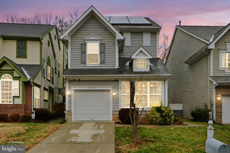 Stunning contemporary home that shows like a model. Sun-filled remodeled kitchen with marble countertops. Cathedral and vaulted ceilings with a cozy fireplace in the living room.

Two-level primary suite with soaking tub and separate shower. Finished walk-out basement with a flexible fourth bedroom or den. Patio with fenced yard.

Enjoy community amenities including a lake with jogging path, pool, tennis courts, clubhouse, and playground. Convenient to Route 50, BW Parkway, Capital Beltway, NASA Goddard, shopping, and dining.