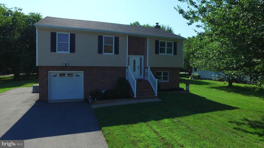 New Price!!!! Water view home with 4 BR, 3 BA and just over 1800 sq. ft. of living space.  Home boasts hardwood floors throughout, open floor plan, granite counters, stainless steel appliances, and crown molding.  Brand new roof just installed (June) and brand new hardwood floors in lower level installed (July).  Large, quiet, private lot just off the water.