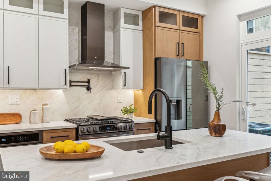 Welcome to 1106 N Bodine Street — the newest offering at The Bodine Three, a trio of architecturally stunning new construction townhomes nestled in the heart of Northern Liberties. ONLY 2 HOMES REMAINING! Just a block off 2nd Street and moments from local favorites like The Piazza and One Shot Cafe, this home delivers luxury living in one of Philadelphia’s most walkable and desirable neighborhoods. Step inside and you’ll immediately notice the thoughtful layout—soaring ceilings, natural light pouring through oversized windows, and dramatic open stairwells connecting each level. Wide-plank white oak floors run throughout, complemented by a stylish second-floor catwalk that overlooks the open-concept dining space below. The lower level features extra-high ceilings, creating the perfect canvas for a home gym, movie room, or guest suite. Each bedroom is tucked away on its own private level, complete with en-suite bathrooms for maximum comfort and privacy. The primary suite is your personal escape—featuring a luxurious spa-style bath with a soaking tub and walk-in shower. Up top, a flexible fourth-floor living space offers a quiet spot to work from home or unwind with a book, and just beyond that, a spacious rooftop deck offers sweeping city skyline views. Enjoy a large private patio, 10-year tax abatement, 1-year builder’s warranty, and premium finishes throughout.  BUILDER IS OFFERING 1 YEAR OF PREPAID PARKING AT A NEARBY LOT. Don’t miss your chance to own a brand-new home in the heart of Northern Liberties—schedule your tour today.