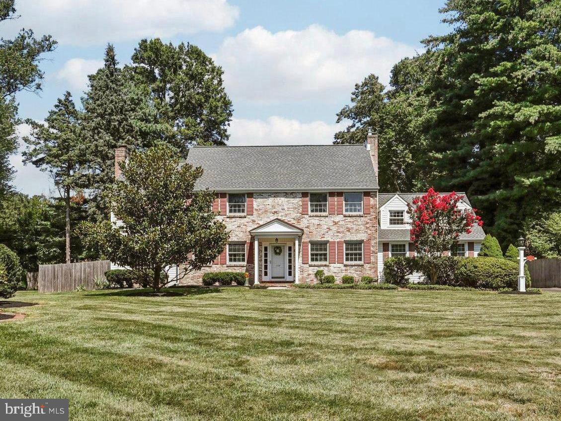 Here’s your opportunity to bring your vision to life in one of the area’s most desirable neighborhoods!
Tucked away in the coveted “Old” Wynnewood section of Yardley, 1334 Moon Drive sits proudly on one of the town’s most prestigious streets. Stately and timeless, the home offers quiet elegance and a commanding presence from the moment you arrive. With 2,821 square feet of finished living space, there’s room for everyone—and unfinished areas to expand or reimagine as you see fit. Step through the front door into the foyer of this classic center hall colonial, and to your right, you’ll find a spacious front-to-back living room featuring a cozy brick fireplace and French doors that open to the rear patio. To the left, a generously sized formal dining room easily accommodates a large table, buffet, breakfront, and more. Just beyond, the inviting family room features knotty pine walls, a wood-burning fireplace, a full wall of built-ins, and a beautiful bow window overlooking the front yard. The eat-in kitchen is positioned at the back of the home and offers a large pantry as well as access to both the back patio and the private, fenced yard—ideal for gatherings or quiet mornings. A large laundry/mudroom and powder room complete the first floor. Upstairs, the master bedroom suite spans the depth of the home and is filled with natural light from multiple windows. It offers ample closet space and a full en-suite bath. Bedroom #2 is bright and roomy, with views of the front yard and a surprise: inside the closet, a hidden staircase leads to the unfinished third floor/attic, offering even more potential space! Bedroom #3 is also generously sized, with two large closets – one of them cedar -- and front yard views, while Bedroom #4 is tucked at the back of the home, featuring a good-sized closet and a standard door that opens to a massive unfinished bonus area above the two-car garage. This flexible space could become anything you imagine: perhaps an office, playroom, gym, or tucked-away retreat. Throughout the home, you’ll find carpets that are likely hiding hardwood floors underneath, just waiting to be uncovered. The full basement is unfinished, offering even more room to expand or use for storage. With a newer HVAC system (2019) and roof (2023), plus a whole-house fan and central air conditioning, you’ll enjoy comfort and peace of mind through every season. Set on nearly 0.4 acres in the award-winning Pennsbury School District, the location is central to everything—shopping, schools, parks, community pool, and library—with easy access to regional rail and major commuter routes including Route 1, I-95, and I-295. With a bit of updating, this gracious home can become everything you’ve hoped for—in the neighborhood you’ve always loved. Bring your ideas and unlock its full potential—this is a rare opportunity you won’t want to miss.