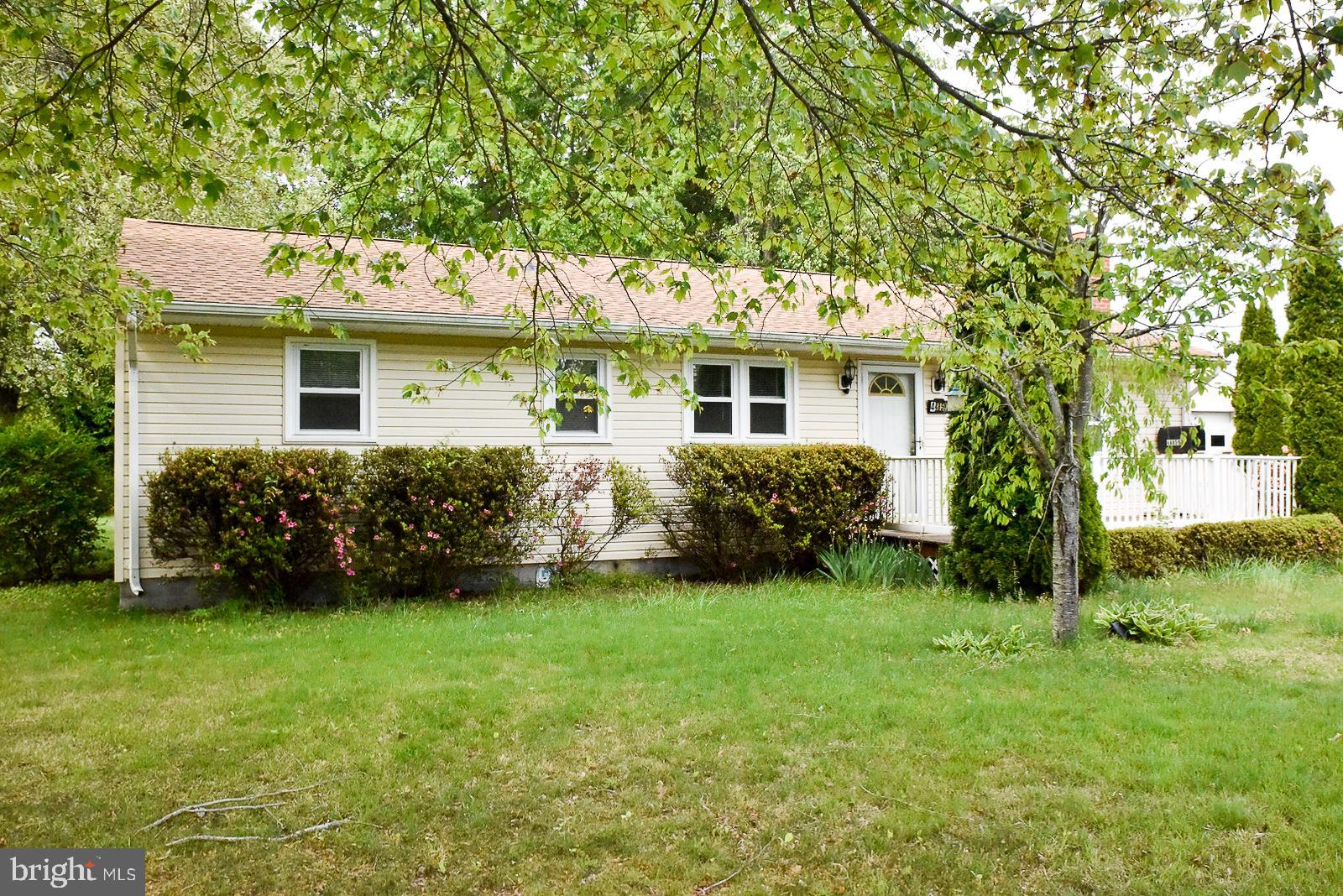 Lots of space in this classic rambler. Hardwood floors throughout, mostly under the carpet. Living room features fireplace. Oversized detached garage is just steps away from house. Enough space for your vehicles and workshop. Fenced back yard. Corner lot. Walk to nearby marinas. Two minute drive to waterfront dining. Regional airport just five minutes away. Property is being sold AS IS.