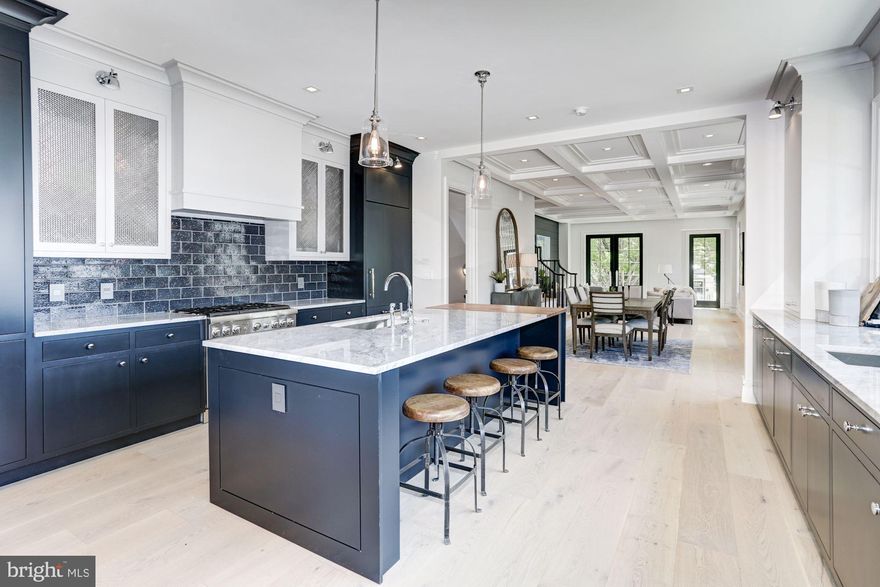 Delivering an elevated standard of comfort and luxury, 3629 T Street NW is a spectacular residence that has been transformed to suit even the most sophisticated palate. Offering 5 Bedrooms and 5.5 Baths throughout four Levels, this special and well-appointed home was completed with a discreet and refined New England Transitional design. The interior spaces have been thoughtfully sculpted to beautifully display bold tile selections, defining millwork including a stunning coffered ceiling and shiplap walls, and wide-plank French flooring. Ideal for entertaining both intimate gatherings and large parties, the gorgeous interiors are accented by generous living spaces, designer Baths, and a distinctive gourmet Kitchen. Four Bedroom suites with private Baths are located on the two Upper Levels and the finished Lower Level provides additional lifestyle space with a Family Room, Wet Bar, a fifth Bedroom, and a Full Bath. An elegant and private flagstone Patio is ideal for relaxing afternoons and convenient off-street Parking is included.