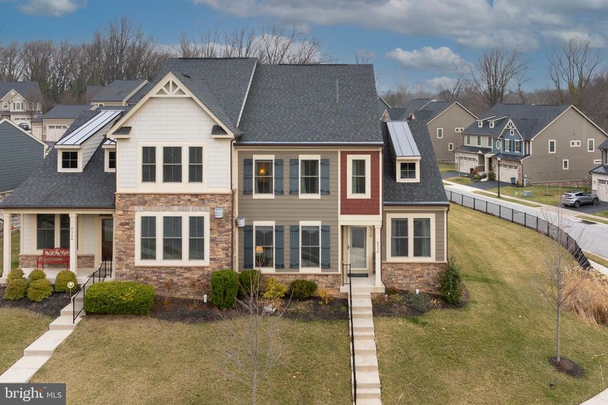 Rarely available home-Gated  55+ Community adjacent to Country Club of Maryland Golf Club- From the covered front porch enter the lovely inviting foyer w/high ceilings to your right is the private office with a gorgeous built in desk system, and immediately to your left is the spacious living room w/lovely built-ins and gas fireplace. Then throughout the first floor there is engineered flooring, crown molding and chair rail which enhances the very open floor plan. The formal dining room is perfect for entertaining and it is open to the luxurious gourmet kitchen. There are  lovely 42 inch cabinets, the granite counter top  houses a five burner gas cook top, a microwave/convection oven, wall oven and refrigerator.  The lovely pendant lights hang over the large 10 foot island w/ granite countertop, seating for 4, stainless sink and dishwasher. There is even room for table and chairs in the kitchen. Off of the kitchen is a convenient mud room w/washer and dryer-powder room and entrance to the lovely screened in porch which leads to the outside deck, and entrance to the double garage. There is an additional golf cart garage for your cart or wonderful extra storage.  Also important to mention is that the primary bedroom is on the first floor, offering an ensuite bath w/large tile shower, Double length vanity and walk in closet w/ Chesapeake Closet organizers. the bath also has a very large linen closet. The second floor offers two bedrooms each with carpeting and huge walk-in closets, a full bath and there is also a loft area that has a large walk-in closet. Many amenities in this beautiful home are-sprinkler system, Gutter helmet system, alarm system, new smoke detectors, 9 foot ceilings, easy golf path to the course from your additional golf cart garage- Beautiful neighborhood-this is one of the largest lots .28 of an acre but easy living for the owner because Included in the fees are road maintenance, hydrants, sidewalks, grass, trimming, mulch,  and water. From the first floor to the lower level there is  a Stannah stairlift, which the seller will remove if the buyer is not interested in keeping it. This is a lovely home top to bottom