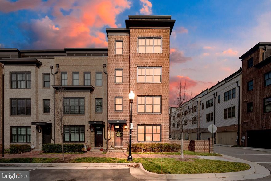 Want all the charm, elegance, and convenience of Old Town but with modern design?  Look no further!  This end unit townhome is the epitome of sophisticated design right out of the pages of a magazine.  With light-filled open spaces great for entertaining, top of the line finishes and appliances, and every detail thoughtfully presented, this stunning all brick four level home with impeccable upgraded engineered floors throughout is perfect for today's city lifestyle.  The entry level office with custom pendant light, closet, and adjoining full bath can be easily adapted into a fourth bedroom or welcoming guest suite.  The stunning main level with open kitchen, dining, and living room has tons of space for every day living and entertaining at its best.  The all white kitchen with Carera marble counters, huge island with built-in storage and bar seating, top of the line GE Monogram stainless steel appliances, and spectacular pendant lights, is the perfect place to create the gourmet meals of your dreams.  Open to the dining and living room, with 9 foot high ceilings and large corner windows, this main space is just breathtaking. Upstairs the primary suite is a work of art.  With curated wood beams and a decorative masonry wall, a dream walk-in closet with custom built-ins, and a spa bath with Kohler dual vessel sinks, glass tiles and an enormous glass enclosed shower, this is a true haven.  Down the hall, the large second bedroom has a spa-like bath of its own in addition to a walk-in closet.  The convenient bedroom level laundry room has great storage built-ins and front loading machines.  The final level family room with a wet bar, wine refrigerator, and adjoining rooftop terrace is the perfect place to host a fun game night.   The last bedroom upstairs comes with its own built-in castle bunk bed!  What child or furry family member wouldn't adore this incredible feature. The two car rear entry garage has an upgraded epoxy floor, an additional elevated storage rack, mounted tv, and a movable utility sink great for cleaning up your furry friends.  This home is truly everything you can ask for with every detail thoughtfully and artfully designed and completely move in ready.  Located just a quick walk to Metro and all the unique shops and restaurants along King Street, not to mention a short bike ride to the river and all the waterfront activities in Old Town, this home is the perfect modern urban oasis.