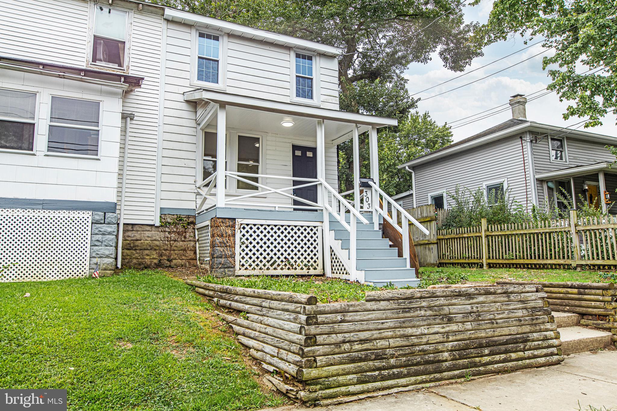 Welcome to this fully renovated 3 bedroom, 1 full and 1 half bath twin, thoughtfully redesigned with open concept floor plan and high-end finishes. The inviting front porch sets the tone for the modern interior. The first floor features wide-plank luxury vinyl flooring, a bright white kitchen with stainless steel appliances, tile backsplash, and striking black doors with gold accents. A sleek, minimalist powder room completes the main level. Upstairs, hardwood floors lead to three spacious bedrooms and a spa-inspired full bath. Additional updates include all new mechanicals, new roof, electrical, plumbing, windows and a new HVAC system. The deep, fenced backyard is just over 1/3 of an acre offering the perfect setting for entertaining or outdoor living. This home stands out with the finest finishes in the area and is priced below recent comparable sales. Move right in and enjoy. Schedule your private showing today.