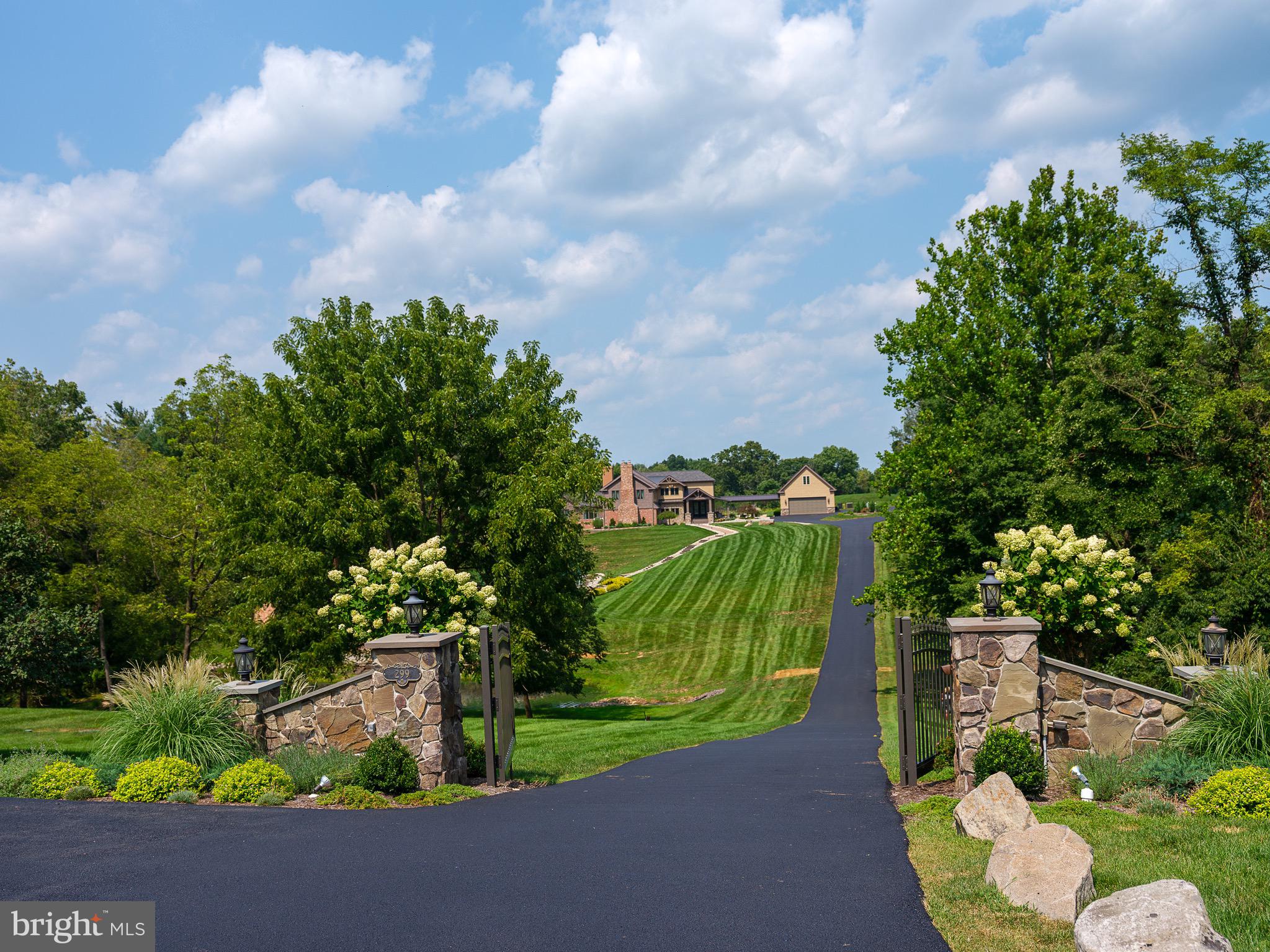 Residing in prestigious Upper Makefield Township, this idyllic luxury estate is a lesson in extraordinary living. Nestled within a serene setting at the end of a long, gated driveway; the 4.56 acres are enhanced by professional landscaped grounds, aerated pond, tournament sized tennis court, and handcrafted bluestone terraces and walkways - all of which create exceptional outdoor living space. Masterful in design, the home is a custom architectural masterpiece. The over 6,000 square feet of living space, in just the principal home, has been architecturally enhanced at every turn; evident in the travertine floors, solid mahogany entryway, custom barn style doors, four fireplaces with custom surround, rich hardwood floors and wine cellar to house the most glorious of wines. The gourmet kitchen, captivating great room and first floor master suite are open to the lanai and pool area with covered summer kitchen and fire pit offering the grandest of outdoor entertainment. Incandescent, the first level master suite demands peace and tranquility. Equally as impressive; the second level hosts two additional master suites, two large guest rooms and a loft. Magnificent in purpose and size; the lower level features a spa, temperature controlled wine cellar, bedroom with full bath, and exercise room with mirrored walls and sliding glass doors to a private patio. Sophisticated and chic, the carriage house carries the same awe-inspiring momentum as the main home. A studio is perched above the detached garage and ready for your finishing touches. Placed strategically, a secondary two bedroom ranch style home sits to the front of the estate. Truly astonishing are the views from the veranda of the principal home overlooking acres of tranquility. Exceedingly private and exceptionally convenient to New Hope - a riverside town steep in history, dining & theatre, Philadelphia, Princeton and NYC; 299 Woodhill Road is the embodiment of Bucks County cultured elegance wrapped in modern luxury. ● For the Buyer’s convenience and the ease of transaction, the Sellers have elected to have this home Cross Keys Certified. This means that CROSS KEYS ABSTRACT. has completed a detailed analysis for the below noted property and has obtained the necessary information required to provide a seamless and timely closing.