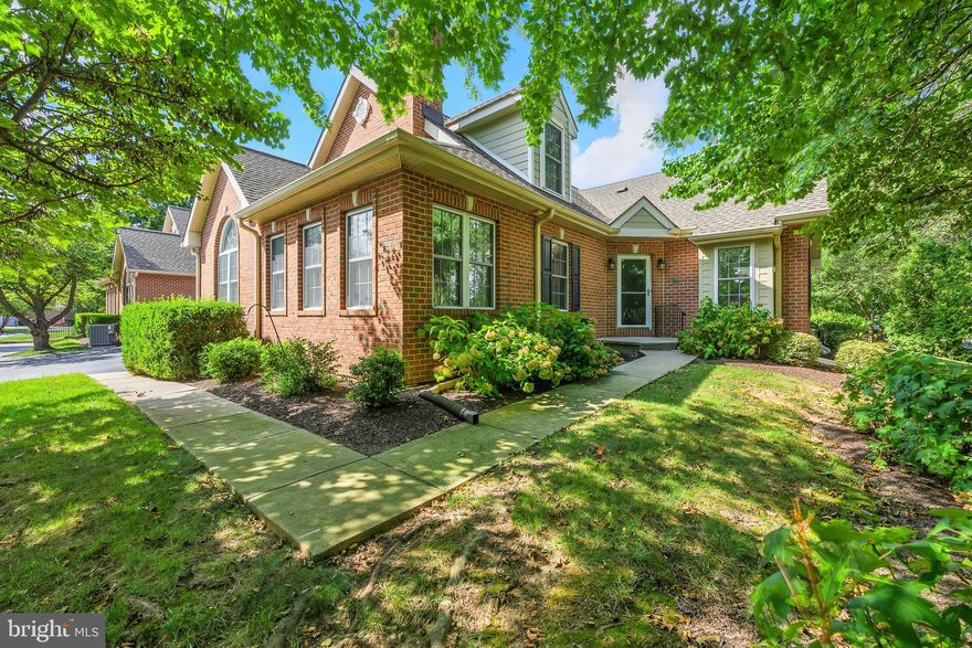 This brick‑front condo in Lynthwaite Farm has been freshly painted and offers two spacious bedrooms and 2½ baths in a serene North Wilmington location. Mature landscaping and a private walkway lead to the covered entry. Inside, the foyer opens to a cathedral‑ceilinged living and dining area with a sweeping arched window and gleaming hardwood floors. A gas fireplace anchors the family room, while an adjoining sunroom with exposed brick walls provides a cozy retreat. The kitchen features granite counters, tile backsplash, abundant cherry cabinetry and stainless‑steel appliances, including double wall ovens and a built‑in cooktop. A breakfast bar overlooks the dining space.
The main‑level primary suite boasts vaulted ceilings, generous closet space and a full bath with dual vanity and shower. A powder room, laundry room and access to the attached garage complete this level. Upstairs, a loft with skylight offers flexible space for a home office or den. The second bedroom is served by another full bath, and there’s even a walk‑in closet for storage. The full basement is a standout, offering a huge finished rec room, space for hobbies and an unfinished area for storage or workshop.
Residents enjoy natural gas heat and central air, plus the convenience of low‑maintenance living in this condominium/townhome community. Set in the heart of Brandywine Hundred near shopping, dining and major highways, 133 Lynthwaite Farm Lane combines comfort and convenience in a charming, mature setting.