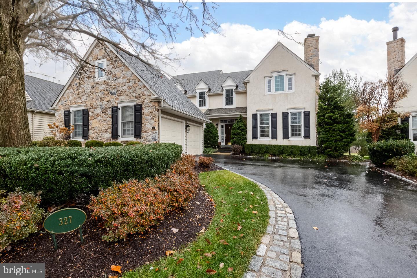 Come see the gorgeous golf course views at the prestigious Applebrook Golf Club! Welcome to 327 Applebrook Drive, a stunning 3-bedroom, 3.5-bathroom carriage home nestled in the prestigious Applebrook community in East Goshen Township. This exquisite property seamlessly blends luxury, comfort, and timeless design in an unparalleled location.  Step into the grand foyer, where you’re greeted by a sweeping staircase, crown molding, and gleaming hardwood floors bathed in natural light. The elegant front sitting room boasts a marble-surround fireplace accented by intricate floor-to-ceiling woodwork, creating a refined ambiance and class. The mirrored wall adds a touch of class with a transom overhead window & glass pane door leading you to the study with built in rich cabinetry, recessed lighting. Hall bathroom just outside the study door for convenience with ornate wallpaper & elegant glass top and glass bowl vanity. The heart of the home is an open-concept living room, thoughtfully designed with recessed lighting, surround sound, and custom built-ins. Flush mount electrical is built into the rich hardwood flooring for ease of furniture and space. French doors span the rear wall of the space with light and frame stunning outdoor views. The gourmet kitchen features a 6-burner gas stove, granite countertops, a spacious island with ornate pendant lighting, double ovens, a paneled Sub-Zero refrigerator. The integration of a secretaries desk creates a centralized place for paying bills, maintaining busy schedules and staying organized, while providing a great use of storage space. Enjoy meals in the sunlit breakfast room with panoramic golf course views. Flowing off of the kitchen is a convenient butler’s pantry to add to your entertaining needs and leads to your formal dining room with chair rail accents & crown molding. A large mudroom area off the entrance to the spacious 2-car garage offers ample storage and maintains you organization needs. Making your way up the staircase you will find a large functional landing with sitting space & shelving nooks for a private quiet space. The master suite is a sanctuary of luxury with tray ceilings, dual walk-in closets, and a spa-like ensuite with a soaking tub, tiled shower, and his-and-her vanities. Two additional bedrooms share a Jack-and-Jill bathroom with separate vanity areas and a skylight.  The finished basement is an entertainer’s paradise, complete with a wet bar, wine fridge, farmhouse sink, and open living space with built-ins. Additional features include a private home gym space, a fully tiled bathroom with walk-in tile shower featuring a stunning waterfall shower head, and an expansive laundry room with a folding and drying station. Outside, the slate patio with a stone wall and vine-covered pergola offers breathtaking year-round views of the golf course, perfect for relaxing or entertaining.  Ideally situated, this home provides easy access to Malvern’s charming shops and restaurants, East Goshen Park, Willisbrook Nature Preserves, and Philadelphia’s Main Line.  Experience unparalleled luxury and convenience—schedule your private tour today.