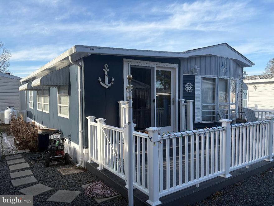 White Horse Park boasts an ideal waterfront location just minutes from Ocean City, with the resort area’s  most affordable vacation and investment properties! This adorable 2  bedroom getaway with lots of sunny windows, features a recently replaced roof, washer/dryer, tankless water heater, skylight, front slider door, paver patio, electrical panel and plumbing. You may relax outdoors on the front Trek deck with vinyl railings or on the patio, adjacent to the storage shed, large enough for all of your beach gear and bicycles.   The convenient location allows for a short walk to  the well-kept amenities of White Horse Park, where you own the land, and never pay ground rent!  Includes a secured gate entry, large swimming pool, marina, boat ramp, crabbing pier, fenced  boat storage, picnic area, playground, bath houses, and laundry areas. The low HOA fee includes water/sewer, lawn maintenance, trash removal, and much more. Some occupancy restrictions apply during the off-season.