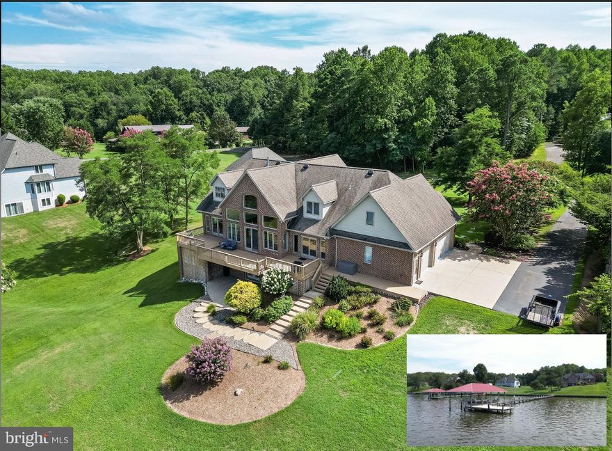 Still accepting backup offers
**Waterfront Paradise on the Patuxent River – Nearly 6,000 Sq Ft of Serenity and Style**

Welcome to your personal retreat on the Patuxent River—where luxury living meets the tranquility of life on the water. Perched on a beautifully landscaped 1.5-acre lot with sweeping panoramic views, this custom-crafted waterfront home is a haven for boating and fishing enthusiasts who also appreciate refined craftsmanship and space to unwind.

A 240-foot private pier with electric and water, a boathouse with a metal roof, and a boat lift make this the perfect launch point for days spent cruising, crabbing, or casting a line. After a day on the river, enjoy the peaceful quiet of the surrounding natural beauty—far removed from the hustle and bustle of city life, yet less than 60 minutes from the DC metro area.

From the moment you arrive, the home’s elegant brick and stone exterior, 35-year architectural roof, and upgraded Andersen hurricane-rated windows (with a 20-year warranty) showcase its commitment to quality and durability. A spacious three-car sideload garage—with 9-ft doors, adds practicality to its charm.

Inside, radiant heated floors welcome you into an open, airy layout with soaring 9.5-foot ceilings, wide-plank oak floors, and a dramatic two-story family room anchored by a floor-to-ceiling stone gas fireplace. Large sliding doors frame stunning views of the river, filling the space with natural light.

The heart of the home is the gourmet kitchen—an ideal space for entertaining or winding down after a day on the water. Outfitted with custom cherry cabinetry, African granite counters, GE Profile stainless steel appliances (including a dual fuel range), and ambient under- and over-cabinet lighting, it blends functionality with elegance. Dine casually in the breakfast nook or gather for special occasions in the formal dining room.

The main-level primary suite is a true retreat—perfect for those seeking the ease of single-level living. Wake up to water views, and pamper yourself in the spa-like bathroom featuring heated floors, a jetted tub, a large walk-in shower with a 6-head body spray system, and custom marble vanities.

Upstairs, two generous bedrooms each offer private baths, window seats, and plenty of storage—including access to off-season closets. The walk-out basement continues to impress with a one-of-a-kind bar crafted from the stern of a historic 40-ft waterman’s boat, plus a full bath, gym or optional 4th bedroom, workshop, and a large concrete storage room that could double as a safe room.

Additional highlights include a whole-house generator hookup, high-efficiency boiler system and heat pumps, a radon mitigation system, and a fully wired security system with cameras.

Whether you're chasing the next big catch, heading out for a sunset cruise, or simply soaking in the stillness of waterfront living, this property delivers it all in a refined, peaceful setting. Come experience the Patuxent River lifestyle—this extraordinary home is ready to welcome you.