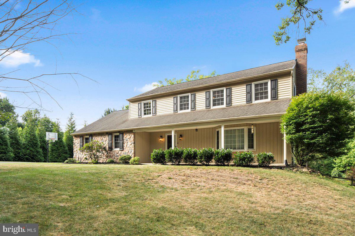 Discover this beautifully updated 4 bedroom home tucked away in the highly desirable Pebble Hill area of Doylestown. Set on a private 1.3-acre lot surrounded by mature trees and a gentle stream, the property offers a serene setting with modern comforts. Once inside, the rich hardwood floors span both the main and upper levels, complementing spacious, light-filled living and dining areas. The remodeled kitchen features a granite peninsula with seating, Bosch cooktop, Dacor double ovens, and a built-in Jenn-Air refrigerator—perfect for both everyday living and entertaining. The adjoining family room, centered around a wood-burning fireplace and custom built-ins, opens to a newly installed Trex deck complete with integrated lighting. Upstairs, the primary suite offers a walk-in closet with an Elfa organization system, a cedar closet, an updated en-suite bath, and a cozy sitting or dressing area. Three additional bedrooms and a full hall bath provide ample space, while walk-up attic access adds storage or potential for expansion. The finished walkout lower level includes a second fireplace, half bath, guest room or office space, and a one-of-a-kind 16-foot shuffleboard table with local history. Step outside to a paver patio leading to endless possibilities- from gardening and outdoor entertaining to simply enjoying the wide open space and fresh outdoors. Plenty of room for a play area or even future additions, this home offers the best of country living. Located on a peaceful street within the Central Bucks School District, this home offers the ideal combination of space, privacy, and location. Additional upgrades include a whole-house Kohler generator (2022), Bryant A/C system (2022), security system, and a newer shed.