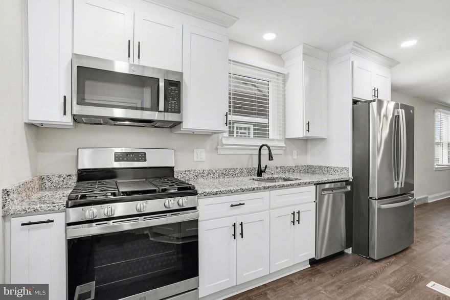 Beautifully updated 3BR home featuring an open, inviting floor plan w/ modern finishes throughout. Renovated KIT w/ granite counters, SS appls & durable LVP flooring. Updated full BA w/ stylish tile, plus 2 HBs—A bathroom on every level for added convenience. The finished LL offers add’l living space & walk-out to flat, fully fenced rear yard—perfect for relaxing or entertaining. Add’l highlights include updated windows, gas heat & cooking, and private 3-car driveway. Don’t miss this move-in ready home in a convenient location.