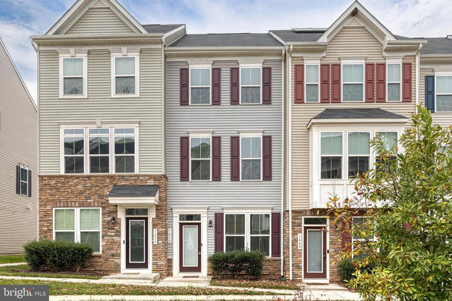 Well maintained three-story garage townhome in private Hanover community,  The main level features an open-concept floor plan with a gourmet kitchen that offers a spacious island with pendant lighting, abundant cabinetry, beautiful granite countertops, tile backsplash, stainless steel appliances, and a breakfast bar. The kitchen opens seamlessly to the dining area and a generous sized living room. A pantry and convenient powder room complete the main level. A glass sliding door leads to the outdoor deck—perfect for grilling, entertaining, or relaxing. Upstairs, the primary suite boasts a spa-like bath with dual vanities, an expanded step-in shower with bench seating, and a large walk-in closet with custom built-ins. A second upper-level suite includes a well-sized bedroom, ample closet space, and an attached full bath. A laundry room and linen closet are conviently located on this level. The finished lower level provides additional living space—ideal for a family room, gym, office, playroom, or hobby area.  This level includes a large storage closet and access to the one-car garage. EV charger included.  Located just minutes from Arundel Mills attractions and a short drive to Fort Meade, NSA, and National Business Park. Convenient to Baltimore and Washington, D.C., with quick access to major highways including 295, 100, 95, and 32.