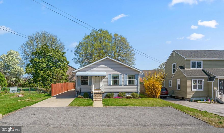 Charming single-family home with 1,120 square feet, 2 bedrooms, and 1 full bath, located in the peaceful community of Oakleigh Beach. An expansive driveway offers extra parking in the front and extends to a detached 1-car garage in the back. Inside, easy one-level living awaits in an open-concept layout featuring a spacious, carpeted living and dining area. The eat-in kitchen includes a peninsula breakfast bar, vibrant tile backsplash, ample cabinet and counter space, a laundry closet, and access to the backyard. Both bedrooms are generously sized with large closets, offering comfortable and functional living. The level, well-kept yard includes a covered patio—perfect for outdoor dining—and a storage shed for added convenience.