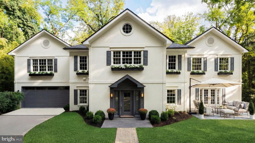 Set far back from the street, 2913 University Terrace NW is introduced by an impressive private driveway and situated on an over half-acre lot, offering exceptional privacy and security in the heart of Kent.

This elegant estate residence is turnkey and features high ceilings, beautiful moldings, hardwood floors throughout, and a thoughtfully designed floor plan. A limestone center hall with a powder room and coat closet leads to a spacious formal sitting room and a grand dining room with French doors that open to a sunny deck.

The expansive living room is ideal for entertaining and includes a fireplace, double French doors to a Juliet balcony overlooking the rear yard, and additional French doors opening to the front yard. The modern kitchen is outfitted with high-end appliances, French limestone countertops, a center island, and ample space for a cozy family area. A main-level laundry room and access to the attached two-car garage complete this floor.

Upstairs, the private primary suite offers a fireplace and an oversized walk-in closet. Four additional bedrooms and three full bathrooms provide generous accommodations for family and guests.
The finished lower level includes a large recreation room with limestone floors, a gas fireplace, and direct access to the backyard. This level also features an en-suite bedroom with a walk-in closet, ideal for guests or live-in staff.

Located in the sought-after Kent neighborhood of Washington, D.C., 2913 University Terrace NW is just steps from local cafes and coffee shops along MacArthur Boulevard. Serene and picturesque, Kent sits on D.C.’s northwestern edge, bordering the wooded trails of Battery Kemble Park. The neighborhood is centrally located between MacArthur Boulevard and Loughboro Road, with Maryland and Virginia just minutes away, offering both tranquility and accessibility.

The expansive lot, private setting, and generous off-street parking make 2913 University Terrace one of the most exceptional estate opportunities in Washington.