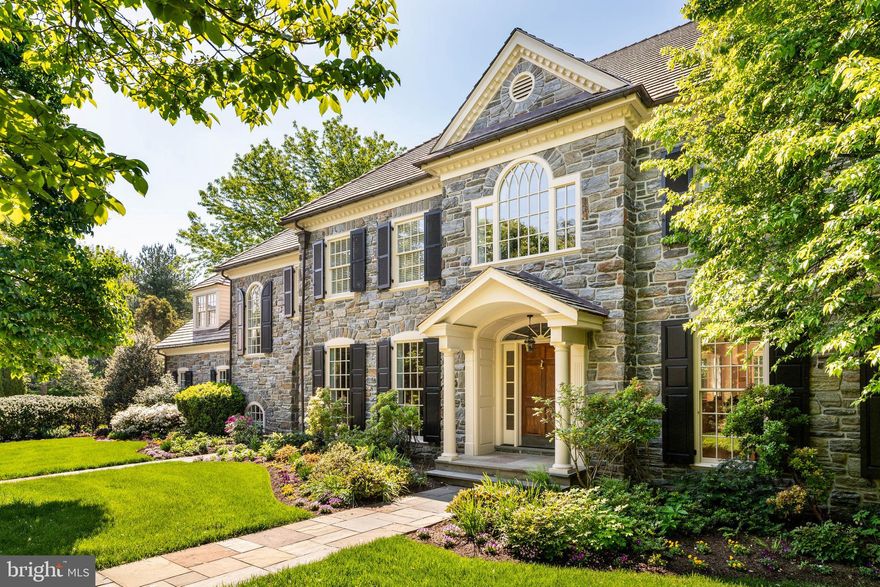 At the end of a cul-de-sac in Villanova, on 1.26 level, manicured acres, this Pohlig-built stone manor home demonstrates the construction discipline and architectural consistency that define the builder’s work.

A front-to-rear center hall organizes the first floor, with the staircase set centrally and light drawn from both ends of the house. The principal rooms open in sequence, front to back, in classical proportion.

The kitchen anchors on a granite-topped center island and opens into a breakfast room set beneath a barrel-vaulted ceiling, with two walls of windows and French doors to the flagstone terrace.

The family room is generously scaled - coffered ceiling, fireplace, a full wall of custom cabinetry, and a run of windows along the rear elevation. The living room, with a classical mantel and its own fireplace, extends to the rear of the house and shares its light.

The dining room is grandly proportioned, its tall windows reinforcing the room’s scale. A first-floor study, finished in wood with built-ins and windows on multiple exposures, sits apart from the main living rooms.

Upstairs, the primary suite includes a fireplace, a sitting area, windows on multiple exposures, walk-in closets, and a private bath. The additional bedrooms are well-proportioned. A room with an arched window serves as a second study, library, or playroom. A second-floor laundry sits within the bedroom wing.

The daylit lower level is finished for how a family lives - children and their friends, family evenings, exercise, retreat, and entertaining at scale. A dedicated home theater with tiered seating and projection. A wet bar with curved counter seating, served by a wine cellar. A pool table in the games area. Exercise room, full bath, and sauna. Open areas for play, games, and gathering.

The rear grounds are private, finished for use as much as view. A flagstone terrace opens off the breakfast room onto perennial gardens, layered plantings, a swimming pool, and a hot tub set within the same plan. Through the warm months, the principal rooms extend outside — mornings on the terrace, afternoons at the pool, al fresco dining in the evening. Southern exposure and shelter from the wind keep the terrace useful except in the coldest months.

Three-car garage. Public utilities. Lower Merion School District. A Pohlig-built stone manor home - proportioned, constructed, and detailed to the standard the name implies — set at the quiet end of a Villanova cul-de-sac that earns the architecture.​​​​​​​​​​​​​​​​

Real estate taxes currently under appeal.