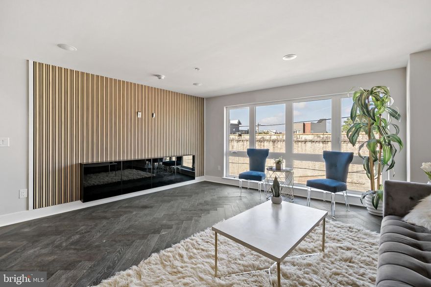 ASK US ABOUT OUR NO MONEY DOWN PURCHASE OPTIONS. ! Welcome to Moyamensing Square , an exciting new construction planned community with 24 chic residences  in the heart of Pennsport !  These units are bi-level with an open floor plan. This Penthouse   unit that gets lots of natural sunlight and  has roof top deck with 360 views city and Bridges.  Features include wide-plank hardwood floors, custom Kitchen cabinets, quartz countertops, and recess lighting, and great city views from each floor.  Main floor has living, room , dinning room, and kitchen. Upper floor has Primany bedroom with ensuite bathroom . Across the hall is two more bedrooms and bathroom. This unit has 1 CAR GARAGE ! Builder is offering one year home warranty and  tax abatement. This a very walkabout neighbor hood that has Dickinson Square park just one block away and Hermanns coffee. There are plenty of restaurants and shopping near by including Target and Ikea . There is still time to pick finishes . Take a look at the attached brochure .  Pennsport is  one of the most storied Philadelphia neighborhoods around with  its vibrant dining, boutiques, and shops are the best of the modern world.  New Construction. Square footage total includes above grade space and below grade space and is estimated. Taxes and square footage to be verified by the buyer. Renderings are for marketing purposes only.  This Unit has upgraded herringbone floors and upgrade Kitchen and  custom tile.