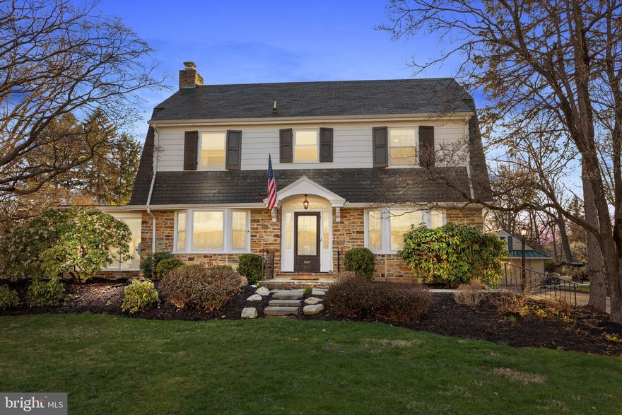 Majestically situated on one of the nicest streets in Langhorne Borough, this gorgeous Dutch Colonial built in 1933 is a fine combination of both form and function. This charming home sits on .65 acres in the heart of the borough with both a swimming pool and an 800 sq/ft detached four car garage. Inside the home, you are greeted by a grand staircase in the spacious foyer flanked by both he family room with stone fireplace and dining room.  The recently renovated kitchen is open to the dining room and has a fantastic walk-in pantry perfect for storing those large appliances and your coffee bar. (This space is currently being used as an office and can be flexed however you see fit!). The family room leads out behind the fireplace to your enclosed sunroom, filled with natural light. Upstairs you'll find  the primary bedroom and bathroom with luxury finishes, oversized hall bathroom with laundry, and three other nicely sized bedrooms. In the hall, a staircase brings you to the large 3rd floor/unfinished attic which is the perfect place for storage or room to expand the home.  The full unfinished basement is even more space to expand your living space and also provides exterior access which brings you directly into your backyard oasis.  The oversized lot has an in-ground concrete pool with newer equipment and plenty of space beyond the fence to utilize or enjoy as an open field. The oversized garage can act as a pool house or storage, the possibilities are endless.  Enjoy walking to downtown Langhorne Boro and all that it has to offer. Small town living close to everything, yet quietly tucked away! Highly acclaimed Neshaminy School District. Convenient to all roads-I-95, US-1, PA Turnpike, 2 local train stations to Philadelphia.