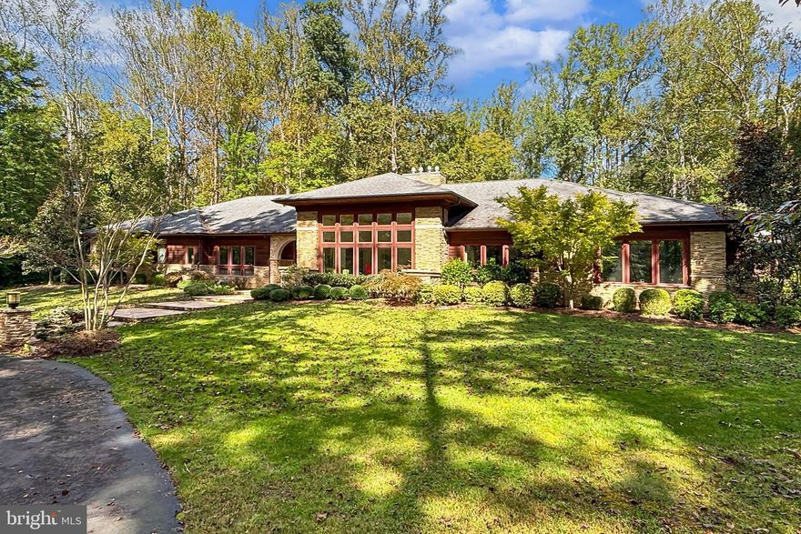 A truly exceptional and expansive home, this 130 foot long Frank Lloyd Wright inspired Contemporary Ranch style home  offers almost 6000 square feet on EACH of two thoughtfully designed levels. Perfectly sited on a five plus acre level lot and surrounded by mature trees, the home exudes serenity and the very best in one level living.  Perfect choice for a home operated business, incredible entertaining opportunities , an elevator and multiple stairways to the recreation and entertainment themed lower level. Multiple laundry rooms, generator, over 1000 square feet of covered and open patios-all located in a serene, privacy enhanced neighborhood just a short distance off Rt 123. Oversized 3 car garage with high doors,. Universal living features include wide hallways and doors. Over 2500 square feet available for future needs.  Great room features 14 foot ceilings and floor to ceiling windows. Cedar exterior.
Professional photos should be displayed by 4/8.  Check back for more details and pics soon. You will NOT find a finer upscale option for one level living -Plus- in Fairfax County!
Current pics were taken in September 2025-current interior and exterior... coming soon!