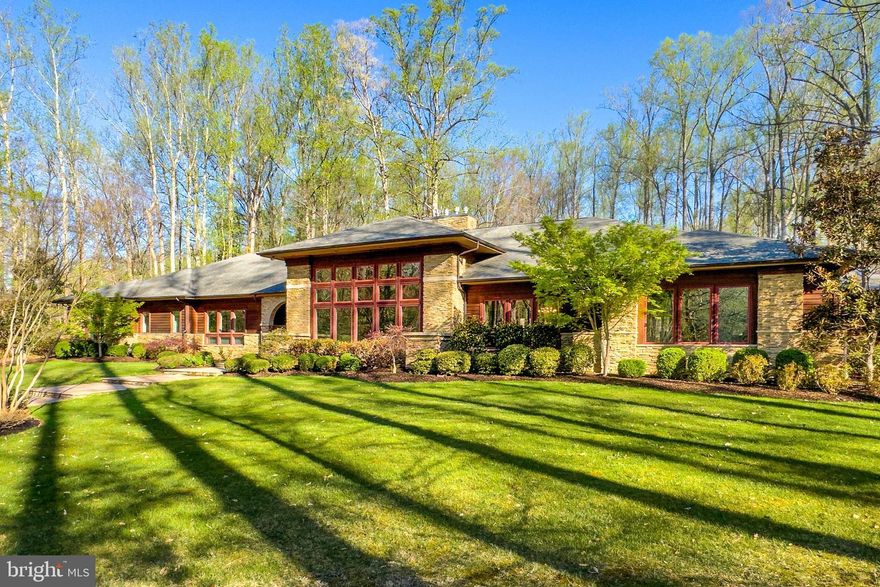 A truly exceptional and expansive home, this 130 foot long Frank Lloyd Wright inspired Contemporary Ranch style home  offers almost 6000 square feet on EACH of two thoughtfully designed levels. Perfectly sited on a five plus acre level lot and surrounded by mature trees, the home exudes serenity and the very best in one level living.  Perfect choice for a home operated business, incredible entertaining opportunities , an elevator and multiple stairways to the recreation and entertainment themed lower level. Multiple laundry rooms, generator, over 1000 square feet of covered and open patios-all located in a serene, privacy enhanced neighborhood just a short distance off Rt 123. Oversized 3 car garage with high doors,. Universal living features include wide hallways and doors. Over 2500 square feet unfinished available for future needs.  Great room features 14 foot ceilings and floor to ceiling windows. Cedar exterior.
.Generator, theatre room, 2 laundry areas. Run your business from the huge home office -or turn that area into an au pair or in law suite.. You will NOT find a finer upscale option for spacious one level living  in Fairfax County!