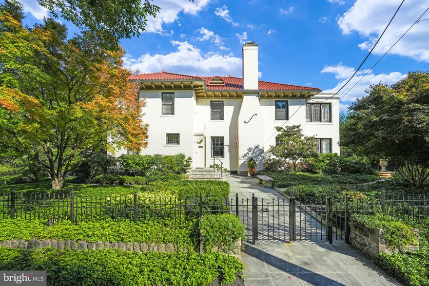 Step into luxury at 2733 35th Street NW, where sophistication meets grandeur in the heart of Washington, DC. This location is unmatched: steps to the National Cathedral and Embassy Row and just minutes to Georgetown. With 6 bedrooms and 6.5 bathrooms spread across over 7000 square feet, this home offers an unparalleled level of elegance. This prestigious property is strategically positioned, offering a unique combination of privacy, tranquil views, and the guarantee of no further development thanks to the vast park right in front of the home. As you step outside, you'll be captivated by the lush gardens that provide a serene backyard haven.

This home is not just a residence; it's a cultural and historical masterpiece where the timeless elegance of Spanish colonial architecture is meticulously preserved. Nestled among embassies, museums, and in close proximity to the Vice President's home, you'll find yourself literally surrounded by history. It's a culturally rich living experience that few can rival.

As you explore the interiors, the expansive main level is perfect for living and entertaining: a chef's kitchen boasts textured countertops, high-end appliances, and a breakfast area. Host your guests in the formal dining and sitting room, and after dinner, retire to the den, complete with its own bar. The double staircase adds a touch of drama when heading upstairs. The upper level includes a spacious primary suite with in addition to 5 bedrooms, one of which can double as an office, a small laundry area in addition to the main mudroom located in the basement, and a sunroom connected to the owner’s suite which boasts its own private rooftop terrace. This versatile space can also serve as a bright fitness room.

The lower level offers practicality, including a laundry area, a dedicated workout space, a second kitchen, and a spacious bedroom suite with its own dedicated entrance.

Natural light bathes the house through numerous windows, especially on the ground floor, creating a bright and inviting atmosphere. There's also a sitting room that's perfect for meetings, reading, or enjoying a cup of coffee.

Outdoor enthusiasts will revel in this property's charm as it's an outdoor lover's haven.  The neighborhood is extremely walkable, with quick and easy access to a myriad of trails, some leading directly to the river, Georgetown, and Dumbarton.

Convenience is another hallmark of this location. You can access multiple grocery stores within minutes, whether you prefer to walk or drive, with Wegman’s, Safeway, Whole Foods, and Giant all at your fingertips. Plus, the neighborhood offers a wide range of functional amenities, including fitness centers, pharmacy chains, and an array of dining options.

This home is a perfect fit for both families and those who love to entertain. The expansive site provides a private oasis, complete with a balcony for breathtaking views and a secluded patio and yard for outdoor gatherings, including a pavilion with a bar and sitting area that has electric heaters, sound system, retractable screens & a fireplace making it functional year round. Situated on a corner lot, this home boasts street parking and a detached garage, combining convenience with luxury city living.

Discover the epitome of elegance at 2733 35th Street Northwest and experience the allure of this remarkable property.