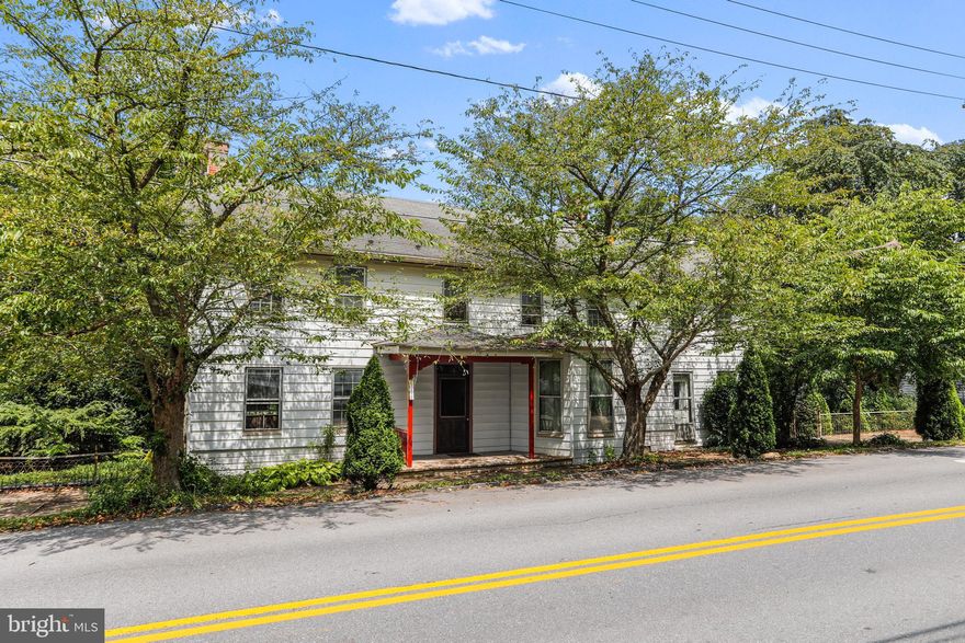 Historic home in scenic Leitersburg, Maryland, This unique home was built in 1816 and features original Pine flooring and windows, 6 panel door and a  walk in stone fireplace in kitchen. 

Updated HVAC (heat pump with central air with oil back up) New hot water heater. Main level Laundry,   washer and dryer convey with the property.
Updated 200 amp electrical service,  water softener, Level lot with landscaped rear yard. 

Second Full kitchen on second floor!

Aluminum siding covers original log and log siding.
Approximate  above grade square footage is 3,300.

Small barn in rear of property.

House needs updates, but has incredible potential, owner has lots of history and provenance on the home.