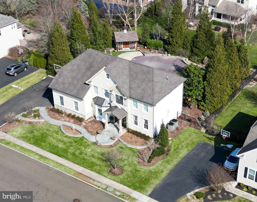 Step into luxury and sophistication at 2099 Derbyshire Road, where elegance meets modern
convenience in the heart of the esteemed Devonshire Estates community. This impeccably
renovated 5 bedroom, 3.5 bathroom home boasts an array of upgrades and enhancements,
ensuring a lifestyle of comfort and style. Upon arrival, be captivated by the stunning
transformation of the exterior. A new front covered porch beckons you inside, while a
meticulously crafted bluestone walkway and capped stone garden walls, bordered by lush
landscaping and accentuated by tasteful lighting, guides you to the entrance. Security is
paramount with the addition of a comprehensive camera system. Every detail of the façade has
been thoughtfully redesigned, featuring all-new siding paired with exquisite stone accents.
Anderson 400 windows adorn the front of the home, allowing natural light to illuminate the
interior. Gutters, downspouts, and Therma-tru doors have been added, ensuring both aesthetic
appeal and functionality. Inside, no detail has been spared. Upon entry is a grand all wood staircase with wrought iron spindles lit by a new chandelier. The dining room has a new chandelier with a stately medallion, crown molding and a large window seat for reading as well as storage. The living room also has crown molding and wood floors. The family room has crown molding and wood beams as well as a gas burning fireplace, mantle, and bluestone hearth as the focal point. A Solatube was also
added for more lighting. The kitchen has undergone a total remodel, featuring top-of-the-line
appliances including a Sub Zero 48 inch fridge, Wolf ovens, a Capital 6-burner range, a Zephyr
hood that vents to the exterior, and Miele dishwasher. Granite countertops, radiant heated
floors, copper kitchen sink and fixtures with water purifier and custom under cabinet lighting
create an inviting atmosphere for culinary delights. A window bench with storage and arched
pass-through adds both functionality and charm. Remodeled pantry with radiant heated floors,
chalkboard pocket door, beverage refrigerator, granite countertop, bar sink with filtered water
and lots of cabinets. Custom mudroom with lockers for storage with charging stations. The
powder room completes the first floor with newer floors, vanity and moldings. The living
spaces, including upstairs, have been meticulously upgraded with hardwood floors, moldings,
and designer lighting. The back staircase leads to 4 bedrooms with hardwood floors, custom
closet organizers and ceiling fans. Retreat to the master bedroom oasis, complete with a
vaulted ceiling with moldings and a spacious walk in closet. The luxurious ensuite bathroom
featuring radiant heated floors, soaking tub, rain shower and wainscoting.  A large second floor laundry room has been added with cabinets, granite countertops, sink, window seat and shutters and TV hook up. The basement has been transformed into a versatile space, ideal for both entertainment and relaxation, with newer flooring, a 5th bedroom and a full bathroom with dog shower and a workout area. Replaced 2 zone HVAC systems with new thermostats. New sump pump, grinder pump and hot water heater. Entertain guests in style with an outdoor space that has been transformed into a haven for relaxation and recreation, boasting a pool, a pool shed for storage, a deck with new trex flooring and fan, and an outdoor kitchen and fireplace with a stone patio. An elegant fence surrounds the entire backyard for privacy. Driveway was replaced and a professional basketball hoop installed. The neighborhood is unique, offering 3 gazebo parks, a tot lot /playground and a one mile walking trail. All this in the award winning Central Bucks School District. From the grand foyer to the tranquil outdoor retreat, every inch of 2099 Derbyshire Road exudes sophistication and comfort, offering the epitome of luxurious living in Devonshire Estates. Don't miss your opportunity to call this exquisite property home.