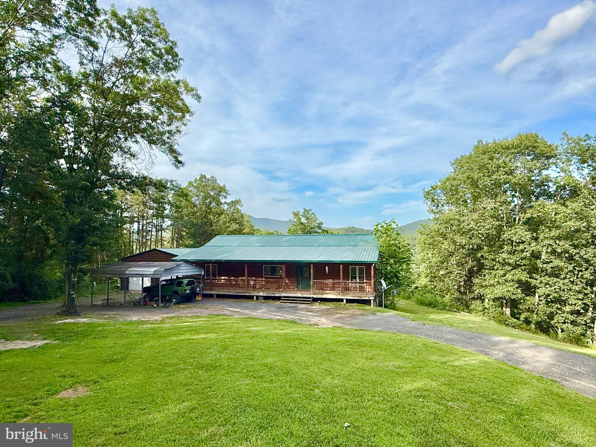 Private Mountain Retreat on 22+ Acres – A True West Virginia Escape
Tucked away at the end of a quiet road, this beautiful one-level mountain cabin offers ultimate privacy and seclusion on 22.40 acres of pristine land. Whether you're seeking a peaceful primary residence, a weekend getaway, or a hunting retreat, this property has it all.
Built in 2017, the home features 3 spacious bedrooms and 3 full bathrooms, along with a full walkout basement that provides ample room for extra living space, a workshop, or abundant storage. The open layout and quality craftsmanship throughout create a cozy yet functional mountain retreat.
An oversized detached garage offers plenty of room for vehicles, equipment, or recreational toys. With ample acreage, there's no shortage of space to explore, hike, or hunt right on your own land.
Conveniently located less than 2.5 hours from both Virginia and Maryland via a nearby major highway, this secluded paradise is easily accessible yet feels miles away from the hustle and bustle.
Don’t miss your chance to own this one-of-a-kind mountain sanctuary. Call today to schedule your private tour!