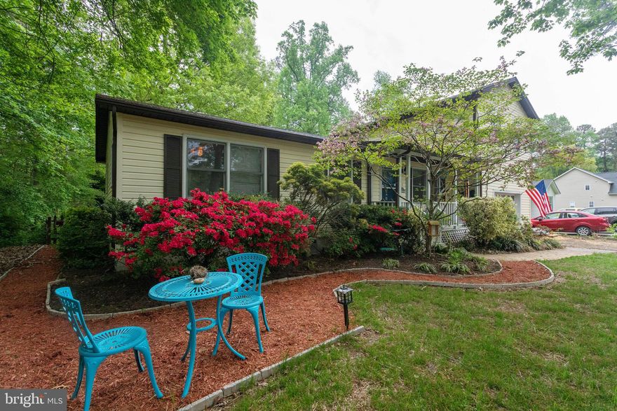 SERENE SETTING WITHIN SOUGHT AFTER WATER ORIENTED DRUM POINT.  WALKING DISTANCE TO THE COMMUNITY BEACH.  AMAZING OVER-SIZED GARAGE (18x28) WITH RECENT MASTER SUITE ADDITION ABOVE, A TON OF STORAGE SPACE AND WORKSHOP  A TINKER'S PARADISE. THREE ADDITIONAL BEDROOMS AND FULL BATH ON MAIN LEVEL.  COVERED FRONT PORCH AND NICELY LANDSCAPED. NEW ROOF (2019), NEW HVAC (2019)!   LARGE, LEVEL FENCED REAR YARD AND MORE!