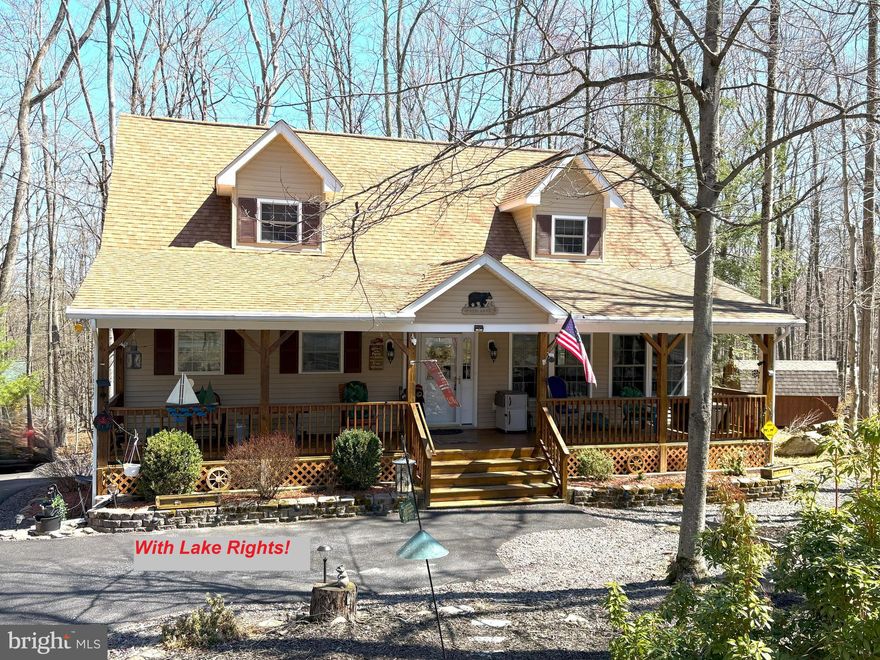 This exceptional property has solid oak floors that creates warmth and sophistication. Enjoy breathtaking 180-degree views of the "Greenbelt Backyard" from the light-filled family room on the main floor.  A bar and entertainment area on the lower level has walkout access to the backyard and firepit space, ideal for hosting or relaxing.  A luxurious primary suite has an en-suite bathroom featuring a jetted soaking tub and a walk-in shower for ultimate relaxation. Three beautifully designed bathrooms, with plumbing ready for a fourth.  This is an energy efficient home with a tankless water heater, two-zoned propane heating, and central air conditioning ensure year-round comfort and cost savings. Extra-wide interior doors offer improved access and ease of movement, perfect for every lifestyle. Convenient extras include a portable whole-house generator, second refrigerator, and stand-alone freezer for added convenience. "Tilt” designed windows make cleaning effortless while flooding the home with natural light. Please see the furniture list with value-add items included in the purchase price of the home. A two-car garage with a dedicated workshop area provides functionality and generous storage. As part of the WLE community, you have privileges to access 2 private lakes, beaches, 2 outdoor pools, an indoor pool & gym, lodges & game room as well as access to the private community marina on the big lake, Lake Wallenpaupack!  Sewer, water, and trash are part of the low community dues.