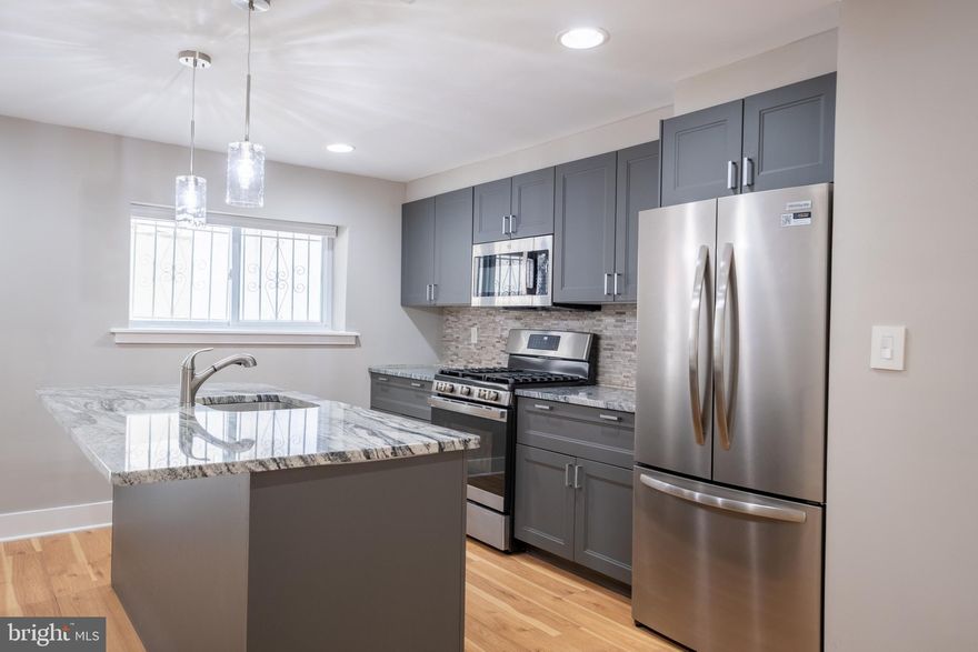 Available for rent: This charming AND RECENTLY RENOVATED THREE-BEDROOM, one-bathroom home is ideally located in the HEART OF THE GRADUATE HOSPITAL neighborhood—just minutes from the University of Pennsylvania, Wharton School, and the Children’s Hospital of Philadelphia (CHOP). With an extra-large layout, this home seamlessly blends modern upgrades with classic Philadelphia charm.
Inside, you'll find stunning wide plank HARDWOOD FLOORS and sleek iron railings throughout, along with frosted glass solid doors that add a sophisticated, contemporary touch. The home features a spacious, OPEN LAYOUT with an abundance of NATURAL LIGHT creating a warm and inviting atmosphere. The gorgeous kitchen is a true showstopper, outfitted with granite countertops, a granite island with bar seating, STAINLESS STEEL APPLIANCES, a stylish tile backsplash, and high-end, soft-close WOOD CABINETRY—perfect for anyone who loves to cook or entertain.
Additional highlights include a beautifully FINISHED BASEMENT that offers extra living space or storage. The custom-designed bathroom features floor-to-ceiling tile that evokes a luxurious European spa feel. Throughout the home, you'll find ample storage space and numerous closets to keep everything organized.
Step outside to your LARGE PRIVATE OUTDOOR SPACE—an ideal setting for outdoor dining and grilling. Located within walking distance to Rittenhouse Square and surrounded by all the vibrant amenities Center City Philadelphia has to offer, this property is truly the best deal in the area. Don’t miss the opportunity to make this exceptional home yours!