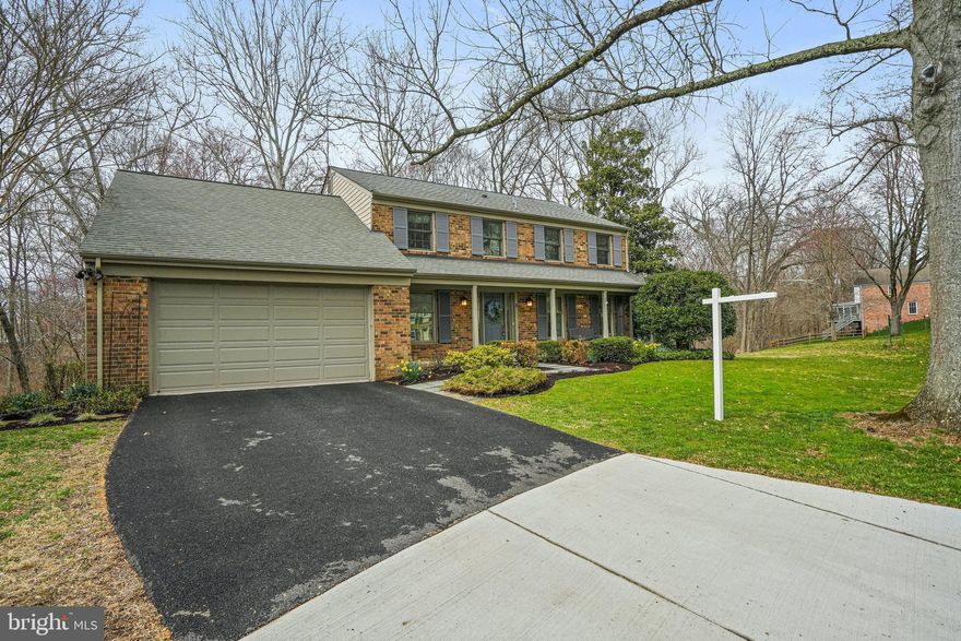 This 5 BR, 3.5 bath colonial home is located in the desired Fallsmead neighborhood and offers the perfect natural setting tucked away and backing to beautiful trees and streams offered by nature's beauty and nestled on a well manicured lot in a quiet cul de sac.  This home offers the perfect combination of elegance and character with modern touches with beautiful well maintained hardwoods on the main and bedroom levels and custom molding trim throughout this home.  The main floor offers a beautiful dream renovated gourmet kitchen for a cook, entertainer or a great place to gather.  The custom cabinet space and granite counters offers lots of versatile space with a large kitchen island, table kitchen space and a desk for the every day "to do" list items.  The Family Room flows nicely from the kitchen to offer a large but cozy space to relax with a wood burning fireplace with built-ins and shelving.  Both the Kitchen and Family Room allow the perfect transition to the two tier large deck that allows you a breathtaking view of nature.   The elegant and spacious Dining Room and Living Room off the Kitchen with the open flow between these two rooms offers even more versatile space for living and entertaining with a butler's area in the Dining Room and built-in shelving in the Living Room.  This floor also offers the perfect home office/den area and a half bath and access to the large 2 car garage with lots of storage options. The top floor bedroom level offers a Owner's Bedroom Suite to pamper yourself with a large bedroom area, lots of closet space and a luxurious bath with a shower and separate soaking/jet tub.    The other bedrooms offer plenty of living space, closets and access to the updated hall bath.  The basement offers comfortable living/family room area that could also be converted to another bedroom area and a full bath with a walk out to the backyard with a slate patio and more amazing views.  This one is a must see and is undoubtedly one of the best locations in this neighborhood.