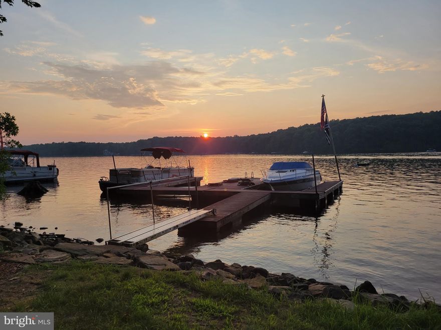 Beautiful Home with 10 acres of property, large garage, and dock slip.