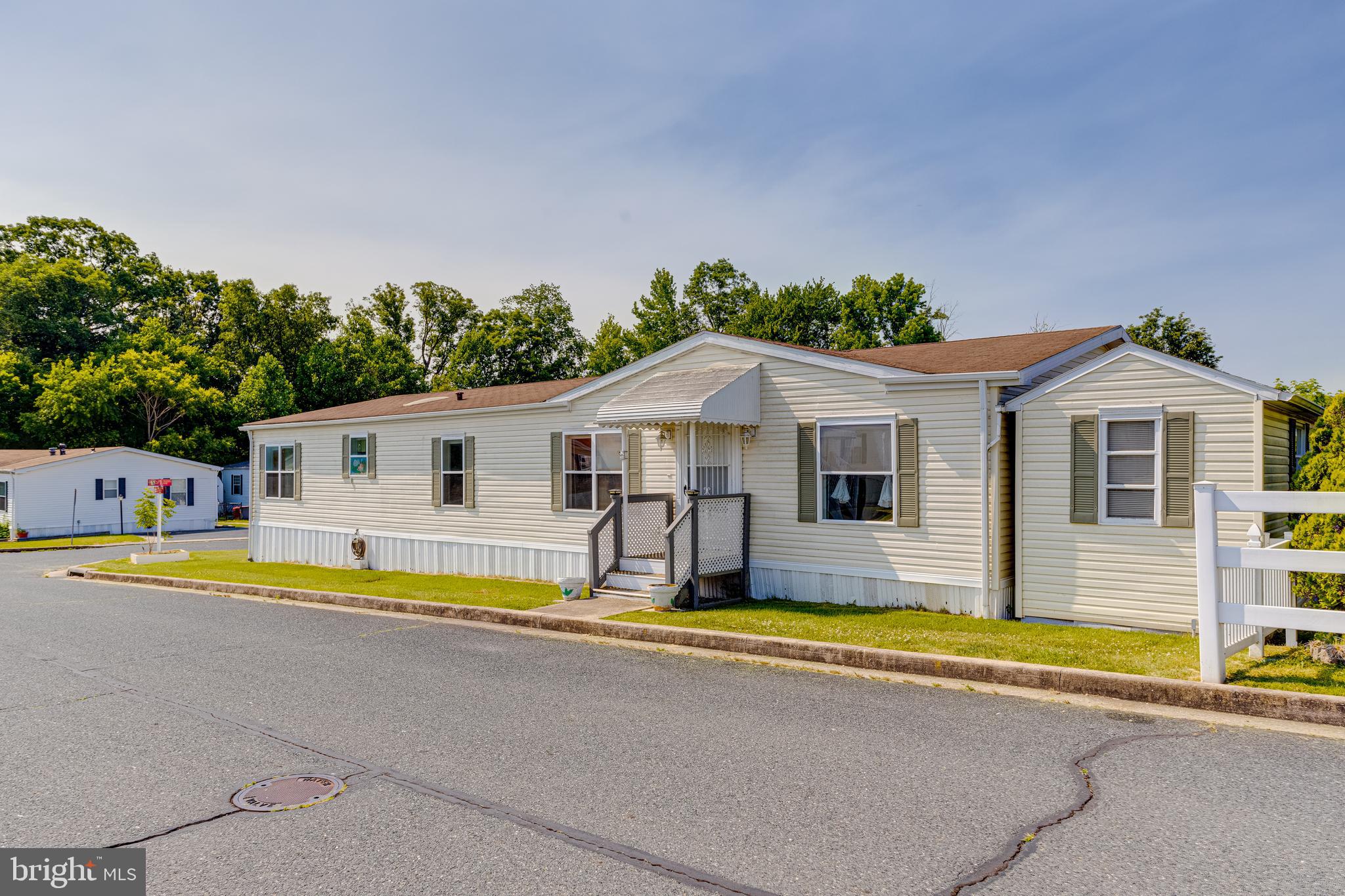 Stunning Double Wide Mobile Home located in Sleepy Hollow Community. The home has a primary bedroom with an on suitefull bathroom. Two additional bedrooms that share a hallway bathroom. Spacious living room area. Seperate dining room. The covered porched that leads into the screened in porch is breath taking and this home even has a shed already onsite.