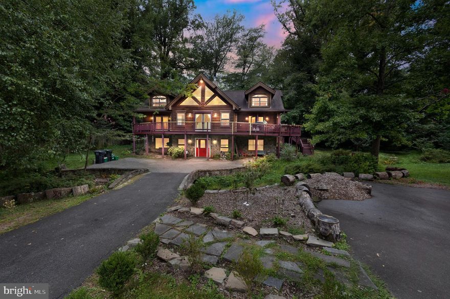 Come find the perfect escape in your own log home surrounded by trees in the heart of Falls Church City. Driving up to the home you are greeted by the magnificent wrap around porch and stunning A-frame nestled into the serene woods. This home is truly an oasis with 8 bedrooms and 3.5 bathrooms - there is room for everyone! Walk through the welcoming red front door to the lower level of the home. You are greeted by an inviting gas fireplace set in warm-toned stone in the living room - the perfect place to relax and chase away the chilly evenings! Four bedrooms and a full bathroom are also on this level in addition to the laundry room and ample storage space. Walk up to the main living level and your eyes are immediately drawn to the stunning abundant natural light pouring in from every angle of this level, filling the cathedral ceilings with warmth. So many beautiful windows make this space feel light and airy while also being a welcoming space to relax, eat, and enjoy time together. Another cozy fireplace (wood-burning with a gas starter) with stone surround is a feature of this level. You truly get the sense that you are in a log home on this level with floor to ceiling beams accentuating the brightness and warmth of this home. The dining room is adjacent to the living room and is surrounded by windows and french doors leading onto the magnificent wrap-around deck - an incredible place to enjoy your morning coffee, grill delicious food or entertain friends and family! The kitchen features a large center prep island, ample cabinetry, and includes a new stainless steel refrigerator and dishwasher, and dual wall ovens. The kitchen door leads to another section of the wrap-around deck with room to eat outdoors and easy access to the side and back yards. The primary bedroom suite is also on this level and is the perfect retreat after a long day. This bedroom includes french doors that gain access to the wrap-around deck and a private en-suite bathroom with glass stall shower, dual sink vanity and jacuzzi tub. A half bath completes this level. As you make your way further up the stairs to the upper level you will find the loft space with glass french doors leading to a private balcony - a sweet spot to get away and enjoy the serene nature. Three additional bedrooms and a full bathroom in the hallway complete this level. Outside of the home you will find a large backyard with a fire pit, a large storage shed and charming footbridge - adding to the serene, natural ambiance of the home. Only a short distance to W&OD Trail, Community Center, Cherry Hill Park, Farmers Market, and the Heart of Falls Church City's Shopping & Restaurants. Less than a mile to East Falls Church Metro Station (Orange & Silver Lines), and 2 miles to West Falls Church Metro (Orange Line), w/ easy access to Major Roadways (I-66, I-495, Routes 50, 29 & 7), and a short commute to the Pentagon and Washington, DC. - Excellent Falls Church City School Pyramid, with newly constructed Meridian High School. You cannot beat the location of this home - enjoy all of the benefits of quiet country living with easy access to the City! Don’t hesitate to make this beautiful log home, your own!