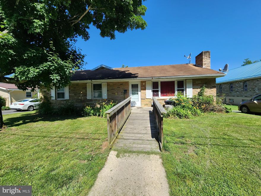 Guess what I found???? 2 homes in one! Some may call it a duplex, some may call it an in-law suite and others may call it EXACTLY WHAT I'M LOOKING FOR! This all one level ranch style home features a large living room with woodburning fireplace, dining room, kitchen, 2 bedrooms, a full bathroom & a primary bedroom with an attached full bathroom. It doesn't end there though! Walk through the shared laundry room to house #2! This part of the home features another full kitchen with space for a table, large living room, 2 bedrooms & a full bathroom. Private entrance in the rear. The shared main floor laundry room could be locked for use of the in-law 2 bedroom private use only and the main dwelling could use the laundry hookups in the lower level if needed. Maybe you just need the extra space with 5 bedrooms, 3 full baths, 2 living rooms and an extra kitchen. The property sits near the end of a quiet street, but still close to town amenities.