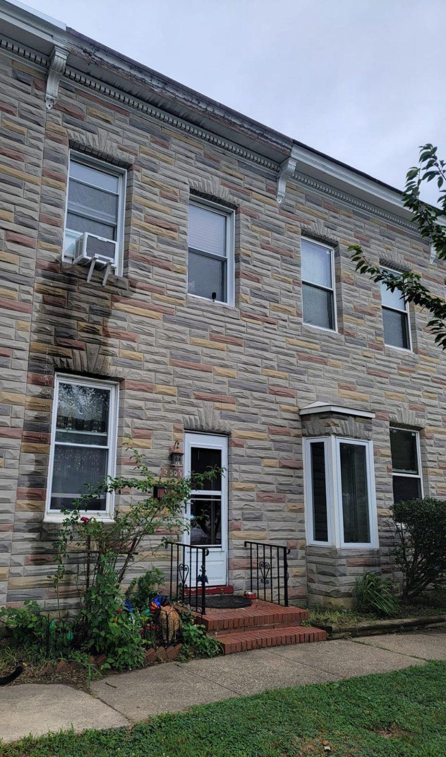 Property was impacted by a fire and is being sold strictly as-is. Ideal for investors or buyers looking for a renovation opportunity.

Interior townhome featuring 2 bedrooms and 1 full bath (upper level), with a traditional layout including a living room with brick fireplace, kitchen, and a dedicated laundry room.

Outdoor features include a rear deck, shed, and parking pad for off-street parking. Partial basement provides additional storage space.