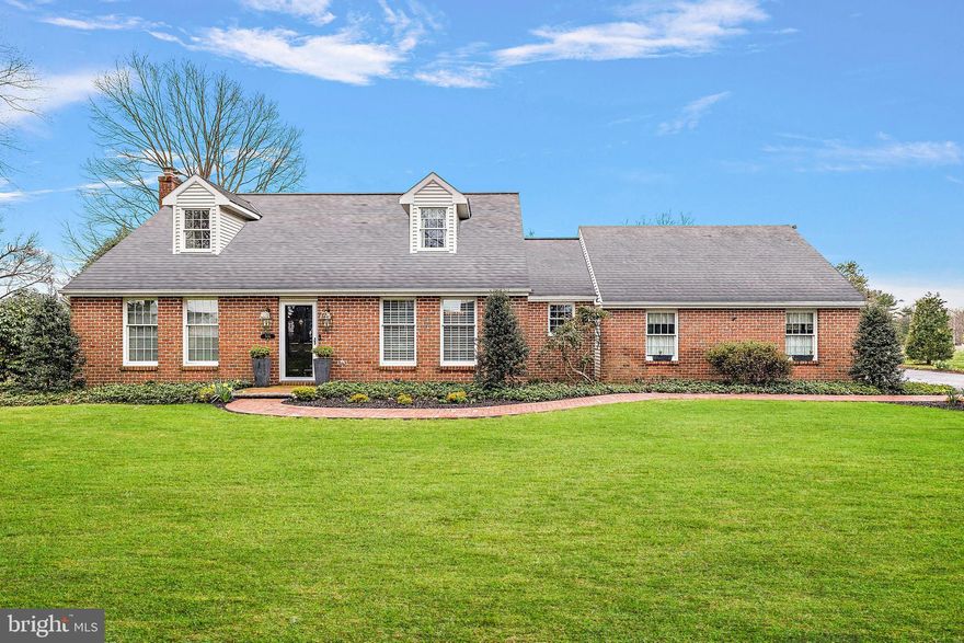 Introducing 506 S Wall Street, nestled on a sprawling 1+ acre lot in East Pikeland Township. Surrounded by over 60 acres of conserved land, this home offers a picturesque backdrop of rolling fields and the serene beauty of nature. Step inside to discover a home beautifully designed and meticulously cared for by its owners. The foyer leads gracefully into a spacious dining room, perfect for entertaining and family gatherings. Adjacent, a stunning eat-in kitchen awaits, boasting granite countertops, featuring stainless steel top-of-the-line appliances, ample custom cabinetry and counter space, and beautiful barn wood beams. This area was designed with gourmet cooking in mind. Seeking relaxation? The exquisite family room beckons with its vaulted ceiling and custom stone propane fireplace, offering panoramic views of the lush backyard. Need a workspace? The home office boasts custom high-end cabinetry and bookcases for optimal storage. A convenient powder room is located adjacent to the office space.  Looking for more living space? Then head over to the living room. This lovely, oversized room is another great space to gather with friends and provides access to one of two charming patio spaces in the back of the home. The spacious primary bedroom awaits upstairs, featuring two closets and an updated ensuite bathroom. Two additional spacious bedrooms, a beautifully updated hall bathroom, and a storage closet round out the second floor. Outdoor enthusiasts will delight in the expansive paver patio off the family room, which features a portico, ideal for alfresco gatherings. An additional patio area off the living room invites relaxation amidst gorgeous landscaping and built-in planting boxes, perfect for cultivating fruits, vegetables, and flowers. Completing this lovely home is a huge unfinished basement offering ample storage and potential for additional living space. Every aspect aspect of this home has been thoughtfully designed from the laundry room to the pretty accents. Lovingly landscaped and maintained, this home is a true treasure for a lucky buyer!