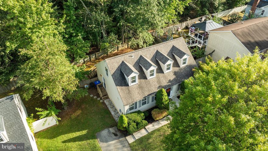 LOCATION, LOCATION, LOCATION!!! Welcome home to this beautiful Cape Cod with 5 bedrooms and 3 full baths designed for comfort, style, and versatility! The main level features a foyer with a French door and a bright living room with new flooring throughout. A Gourmet Kitchen boasting an island with a stove, Wall Oven, big pantry, abundant cabinets, and dining area, perfect for the chef in you and ideal for gatherings. A brand-new sliding door was installed opens to the deck, fenced-in yard that backs to the trees for entertaining and relaxation. (Although currently staged, the home will soon be de-staged to give buyers a fresh, more open look and better feel for the space, photos show the staged version for reference). The MAIN-LEVEL PRIMARY SUITE is a rare find, offering convenience for those who prefer everything on one level, yet privacy with the rest of the bedrooms upstairs, truly the best of both worlds. The upper level includes 2 Bedrooms and a Full Bath, with dormer windows and roof fairly newer. The fully finished lower level adds a spacious family room, 2 Bedrooms, Full Bath, a dedicated laundry room, and plenty of storage leading to the back that has a newer completely covered entrance. Updates include new flooring, new doors, some painting, power washed, professionally cleaned top to bottom and more. Convenient to DC, Northern VA , Baltimore, all major Airports, Military Bases, Restaurants, and Shops. The Roof is fairly new! Sold "As Is" (see addendum) with a 1-year HSA warranty! This is your future home :)