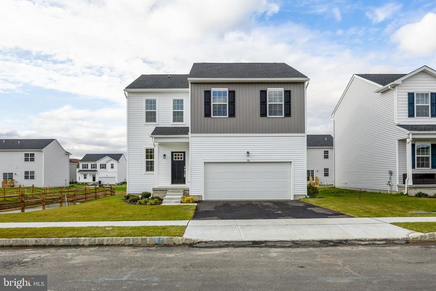 Simplicity, modern design, and bright open spaces come together at 110 Old School House Road. The Fairfield model by Lennar offers 4 bedrooms, 2.5 baths, and a finished basement with plenty of room for today’s lifestyle. The open main level connects the kitchen, dining, and family room for easy living and entertaining. The kitchen features quartz countertops, stainless steel appliances, designer cabinetry, and plenty of counter space. Upstairs, the spacious primary suite includes a walk-in closet and private bath with dual sinks. Three additional bedrooms share a full hall bath, and the laundry room is conveniently located on the same level. The finished basement adds flexible space for a play area, home gym, or movie nights, plus two unfinished sections for storage. Located near shopping, dining, major highways, and the Gloucester Premium Outlets, and served by the Gloucester Township School District.