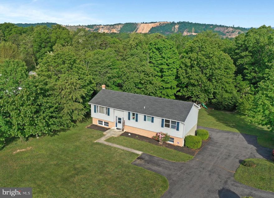 BE SURE TO CHECK OUT THE MOUNTAIN & PASTORIAL VIEWS FROM THIS  WELL MAINTAINED 3 BEDROOM & 2 BATH HOME SITUATED ON .64 ACRES+- & CONVIENT TO I-70 FOR EASY COMMUTING.  APRROXIMATELY AN HOUR & A HALF FROM BALTIMORE & DC. JUST A SHORT DRIVE TO HISTORICAL BERKELEY SPRINGS WITH IT'S SPAS, FINE DINING, SHOPPING & ART COMMUNITY. ALSO A SHORT DRIVE TO HANCOCK MD WITH THE WESTERN MD BIKE PATH, C&O CANAL & POTOMAC RIVER.  VERY CLOSE TO THE NEW HOSPITAL IN BERKELEY SPRINGS. SIT ON THE REAR DECK TO WATCH THE WILDLIFE & JUST RELAX. NO HOA & ON PUBLIC WATER & SEWER. POSSIBLE ADDITIONAL BEDROOM IN THE BASEMENT. COUNTY MAINTAINED FAIRVIEW DR DIRECTLY IN FRONT & A PAVED DRIVEWAY.