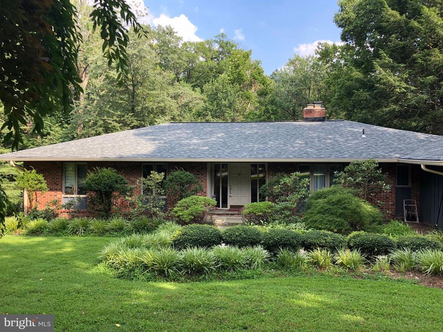 LOCATION, LOCATION LOCATION!!! Stunning 5 bedroom, 3 full-bath Mid-Century Ranch on a QUIET cul-de-sac in desirable Balmacara Estates in Mclean, VA. CHURCHILL Road, COOPER, and LANGLEY High School pyramid!!! Explore the OPEN FLOOR plan with oversized windows that flood the home with NATURAL LIGHT. Sit back and relax with your morning coffee in the SUN ROOM - which feels like you're in a treehouse - or on the EXPANSIVE deck, with a glass of wine, while listening to the gentle babble of the nearby stream and adoring the amazing PRIVATE views of the estate. ENTERTAIN in your SPACIOUS living and formal dining rooms, or enjoy a smaller family meal just off the kitchen. Conveniently located MAIN-FLOOR Master Bedroom/Bathroom alongside two spacious bedrooms with hardwood floors and a bathroom. Enjoy the convenience of the main-level laundry room and take advantage of the expansive lower level with two additional bedrooms, a bathroom, and walk-out access to an extended patio. Stress-free lawn care and maintenance included each month. Enjoy the lush landscaping and extended driveway for plenty of parking.  Easy access to 495, Dulles Toll Road, George Washington Memorial Parkway, and Georgetown Pike.